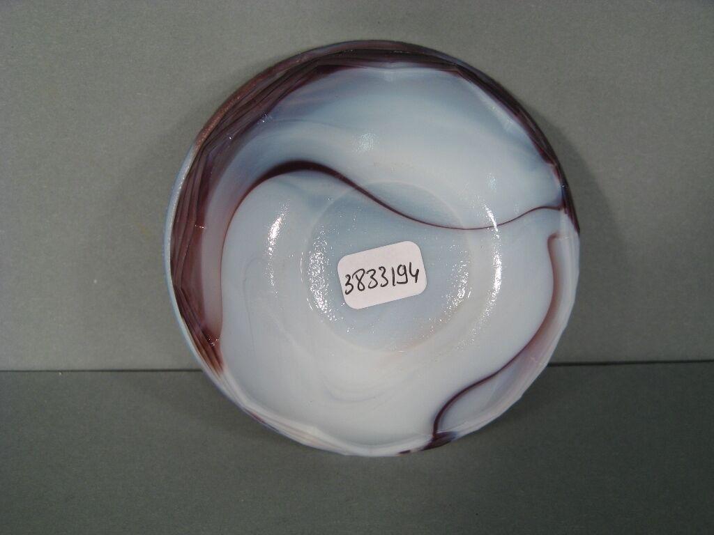This captivating Art Deco opaline candy dish adds a touch of elegance and vintage charm to any home décor. The intricate details of the opaline glass and the sleek Art Deco design make it a delightful addition to any