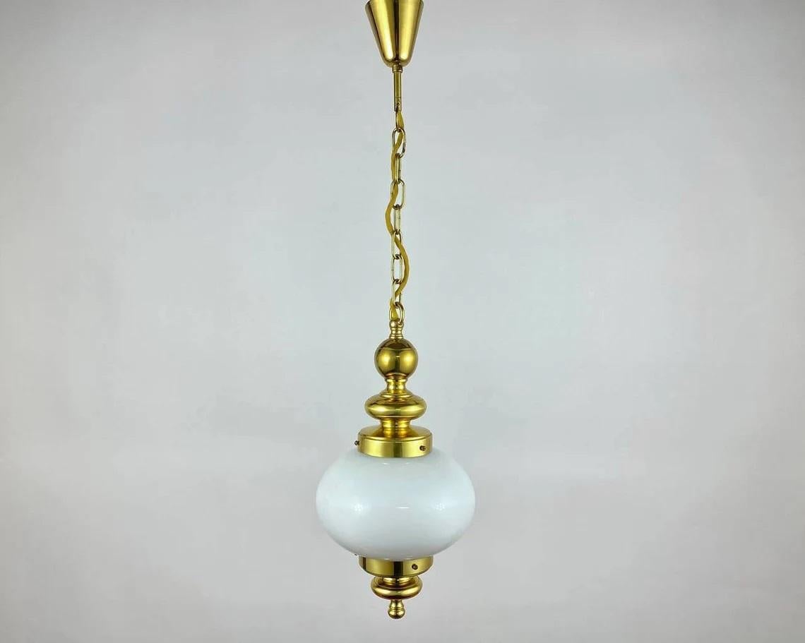 Fabulous old chandelier with a white hand blown opaline globe shade provides soft diffused lighting and give the model a romantic, sophisticated look!!

Vintage hanging lamp in Art Deco Style. This magnificent light fixture has a beautiful gilded