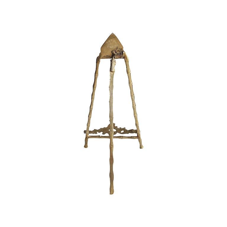 A lovely gilt brass faux bamboo tabletop display easel. A unique way to display cherished paintings or photos. This easel is created from brass and has faux bamboo legs. Two front legs splay outwards and include a stylized Art Nouveau ledge to hold