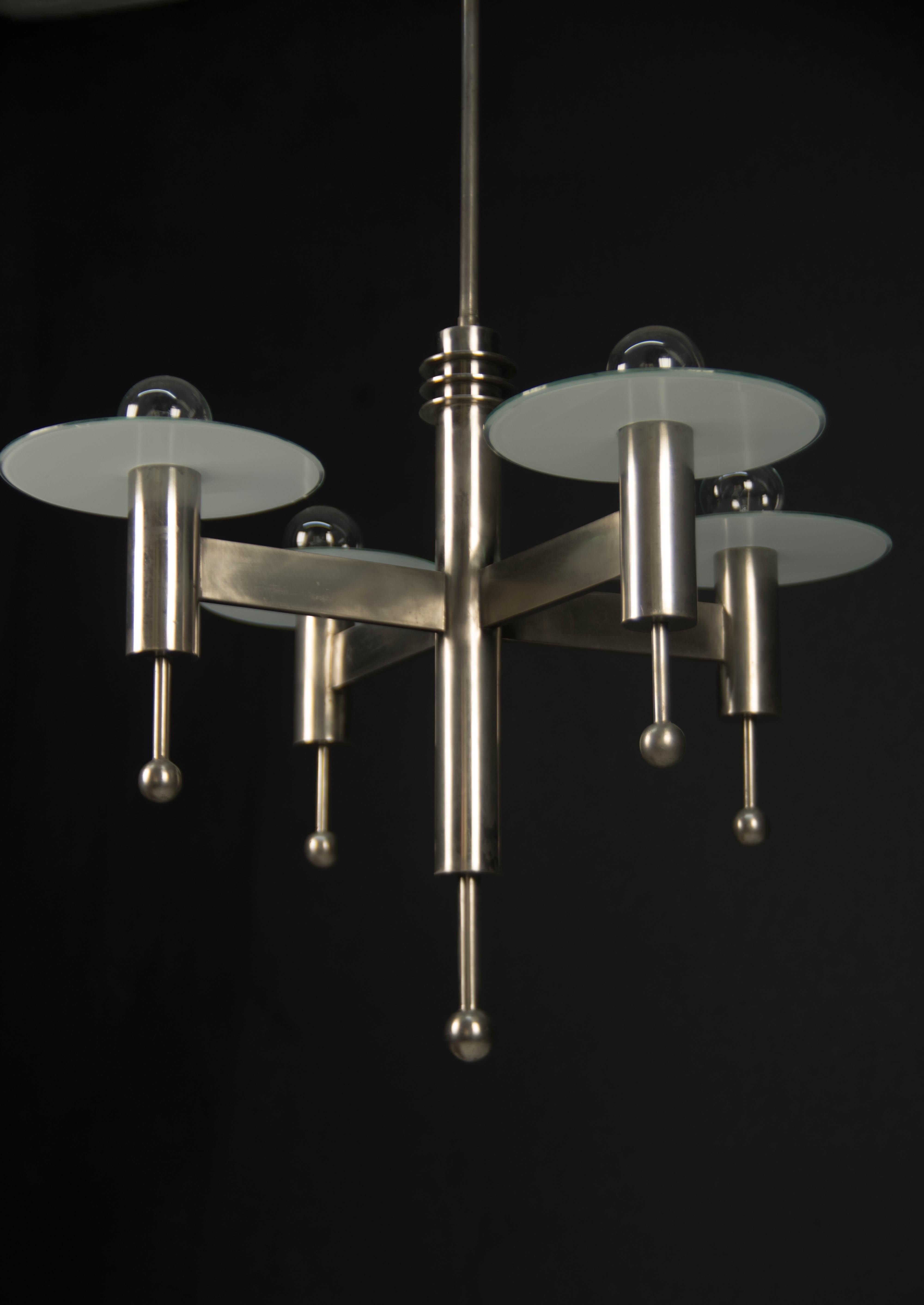 Rare Space Age chandelier. Very eye-catching piece!
Original nickel with minimum age patina - polished
Original opaline glass- diameter of glass - 21cm
4x40W, E25-E27 bulbs
US wiring compatible.
Shipping quote on request