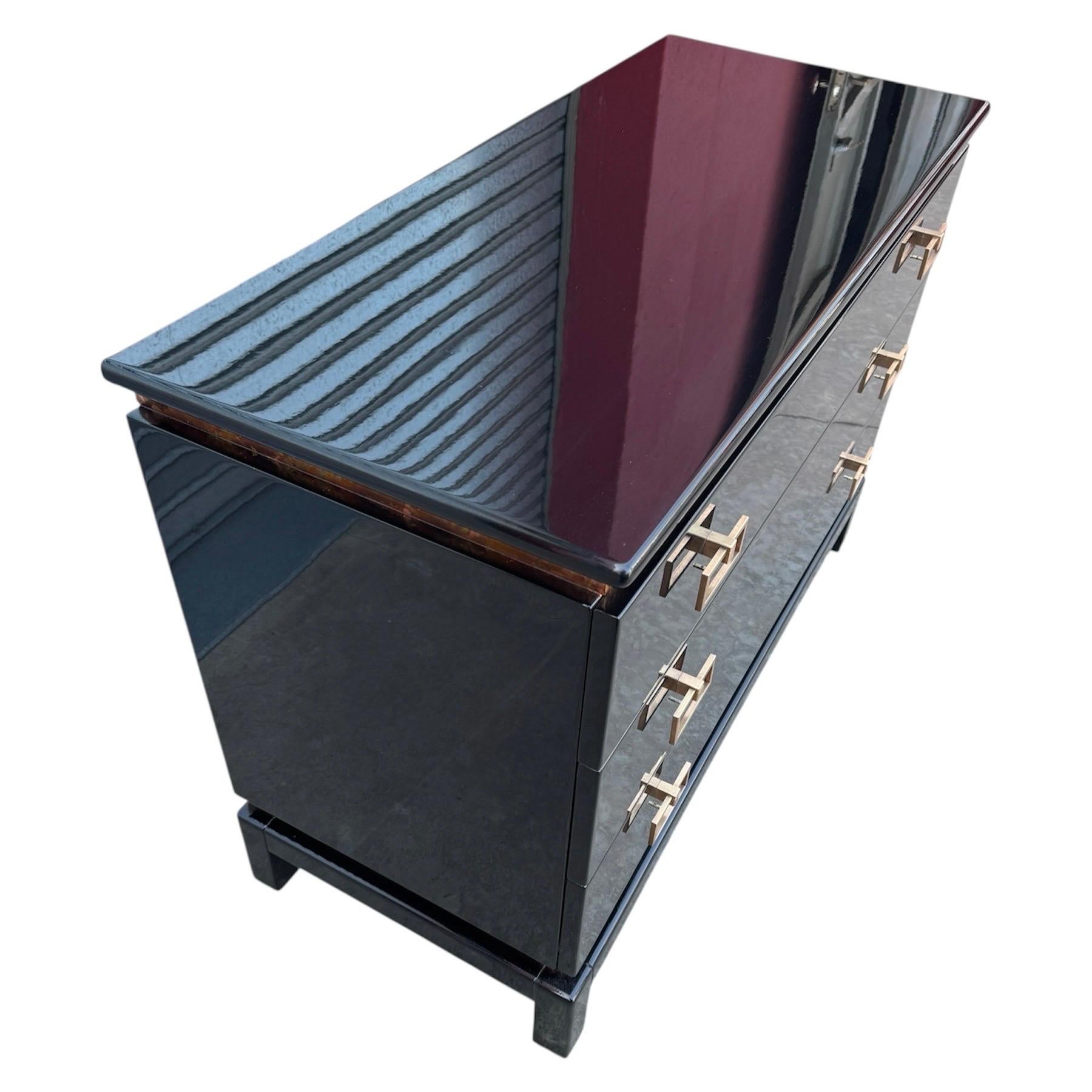 Exceptional Art Deco Oriental Style Black Lacquer Three-Drawer Commode/Dresser with Hand-Applied Gold Leaf Details

An exquisite commode or dresser crafted in the Art Deco Oriental style (also known as Japonisme or Chinoiserie Deco), a design fusion