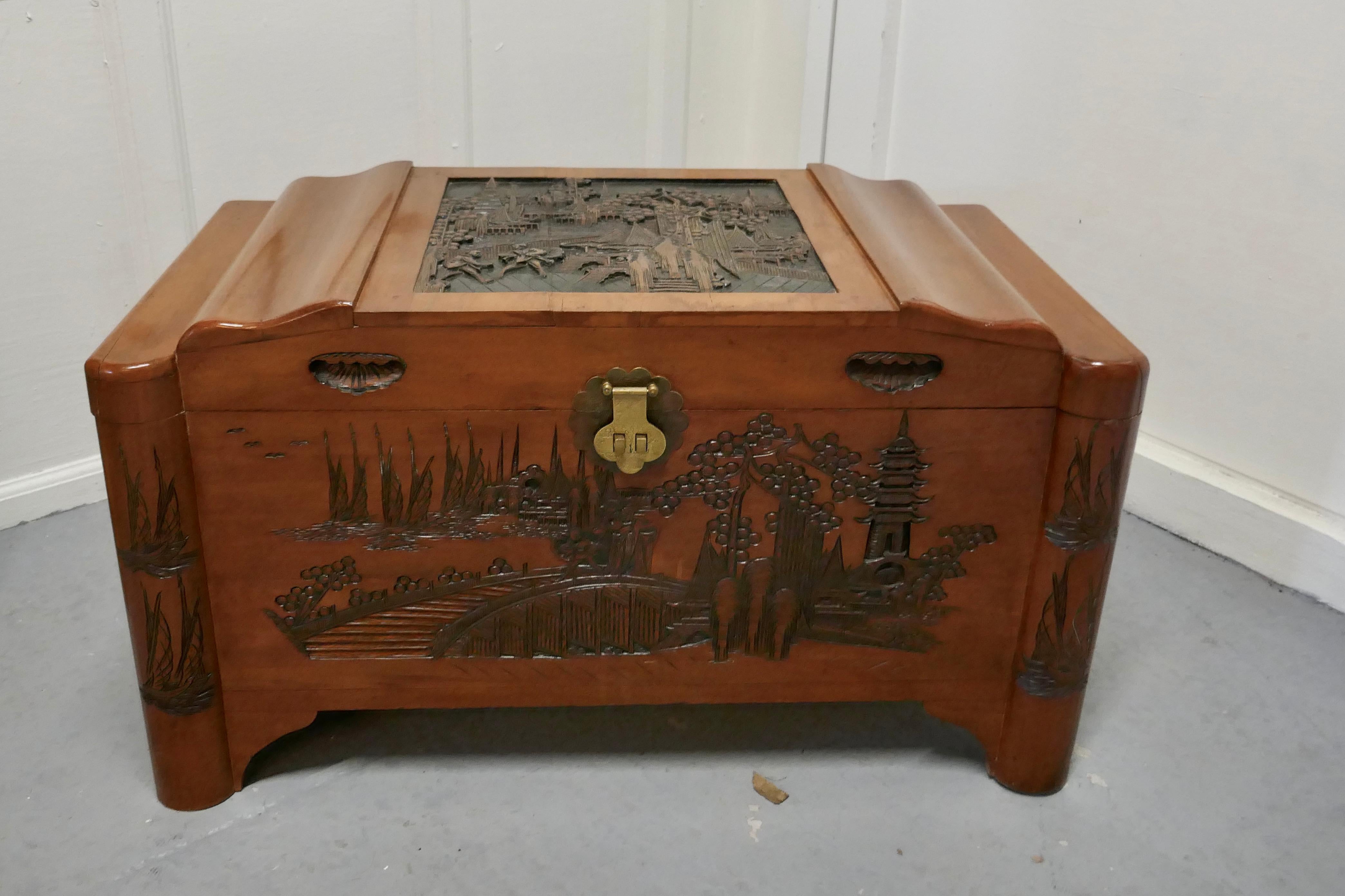 Art Deco oriental carved camphor wood chest.


This beautiful carved chest is made from camphor wood, for those of you who do not know camphor wood it is a hard wood which lends itself very well to carving.
However the main reason for using