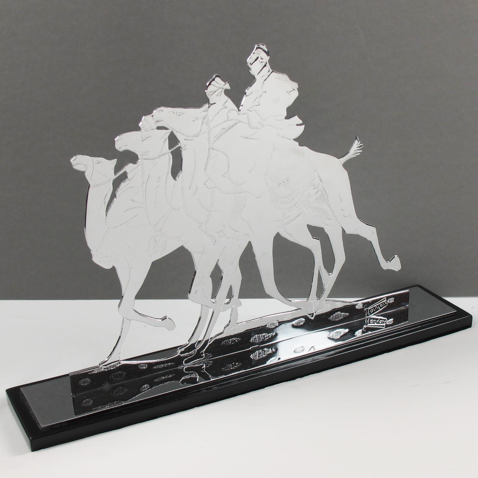 This beautiful French Art Deco chromed metal profile sculpture features Saharan characters, possibly nomads or Touareg (Tuareg,) sitting on camels in amazingly realistic riding action. The heavy-quality metal has a signature on the side. Check the