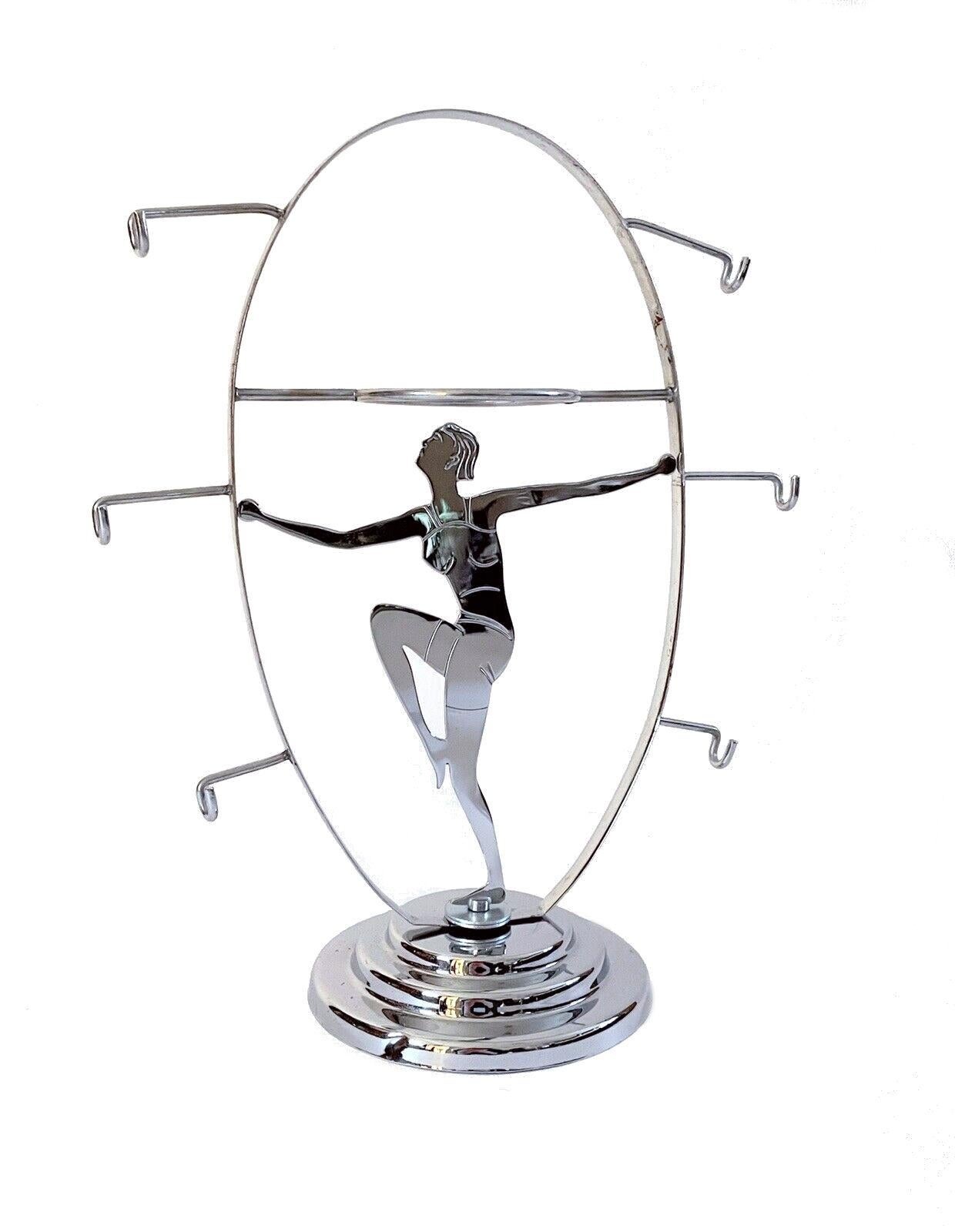 For your consideration is this genuinely rare and highly collectable 1930's chrome Art Deco Chrome Lady Teacup and plate stand, featuring a two dimensional bathing belle in the fashion of the day swimming costume. More often seen are the