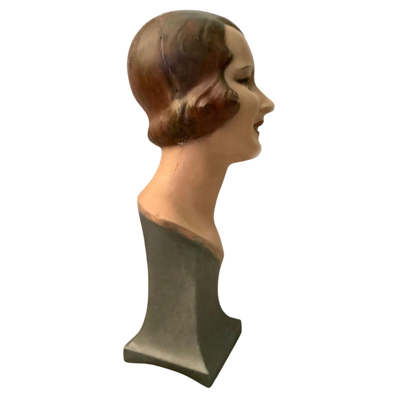 Wonderfully stylish and completely original rare 1930's Art Deco female advertising shop counter mannequin. She's made from hollowed plaster and has a hardboard base. Having been very skillfully and beautifully painted, her very subtle make up,