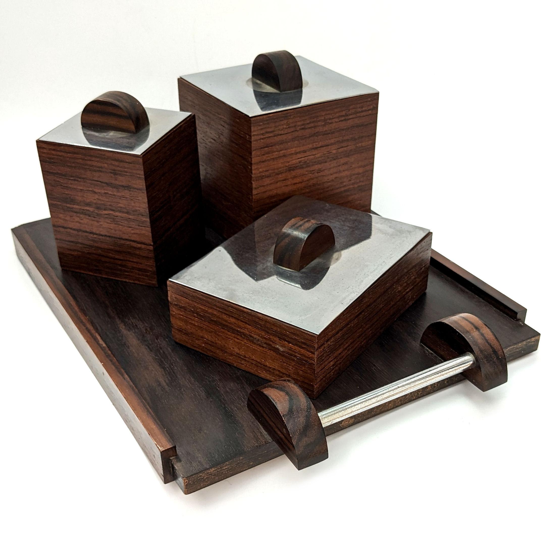 For your consideration is this rather stylish set of modernist Art Deco Walnut boxes set on their own matching tray. Dating to the 1930's and French in origin this set may have been originally intended as a smokers set or perhaps even tea leaves,
