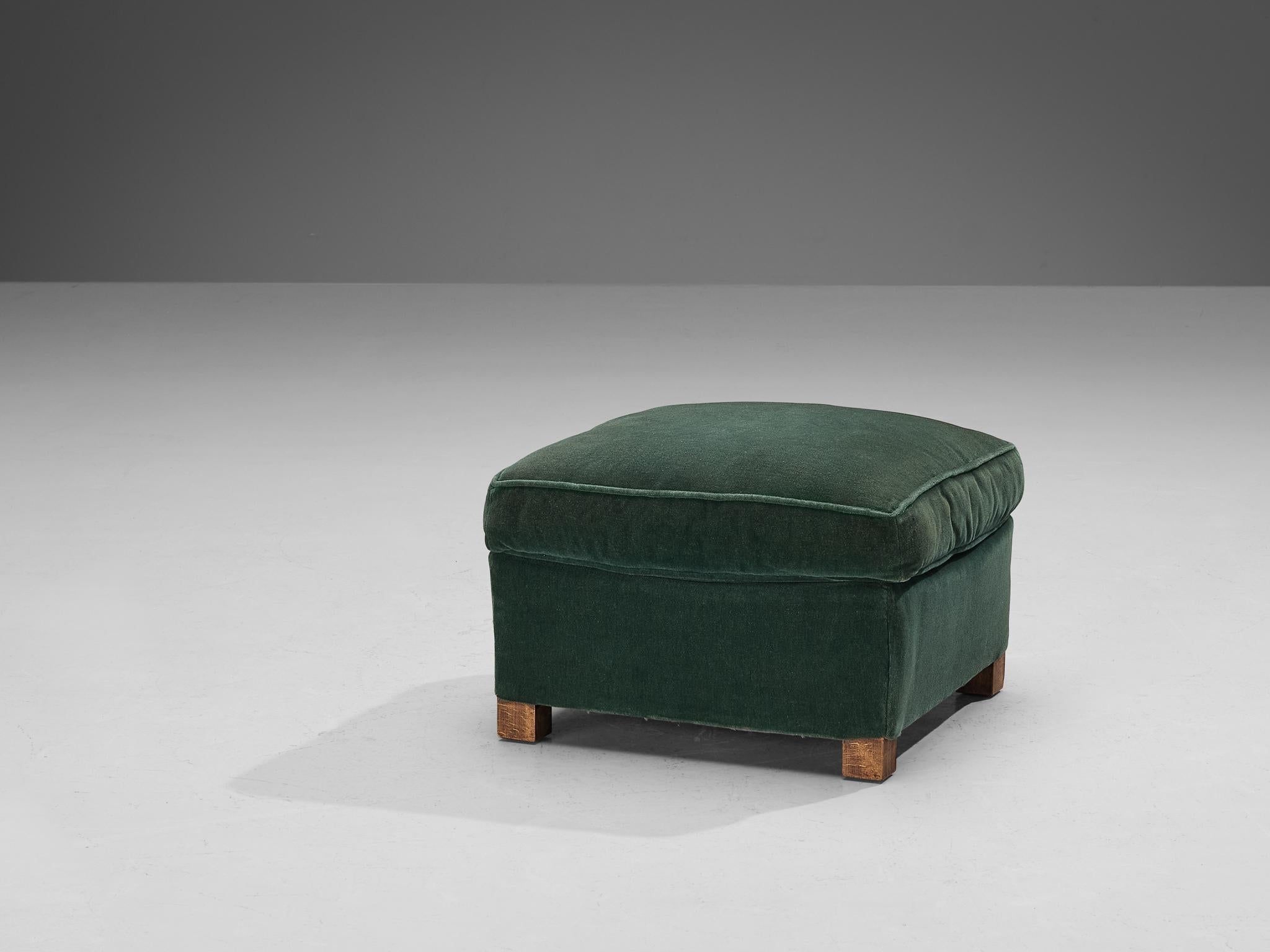 Ottoman or pouf, velvet, beech, Europe, 1940s

Elegant in line and practical to use, this ottoman is exemplary for Art Deco design. A bulky and voluminous seat upholstered in a fine green velvet is accompanied by four short legs in wood. This