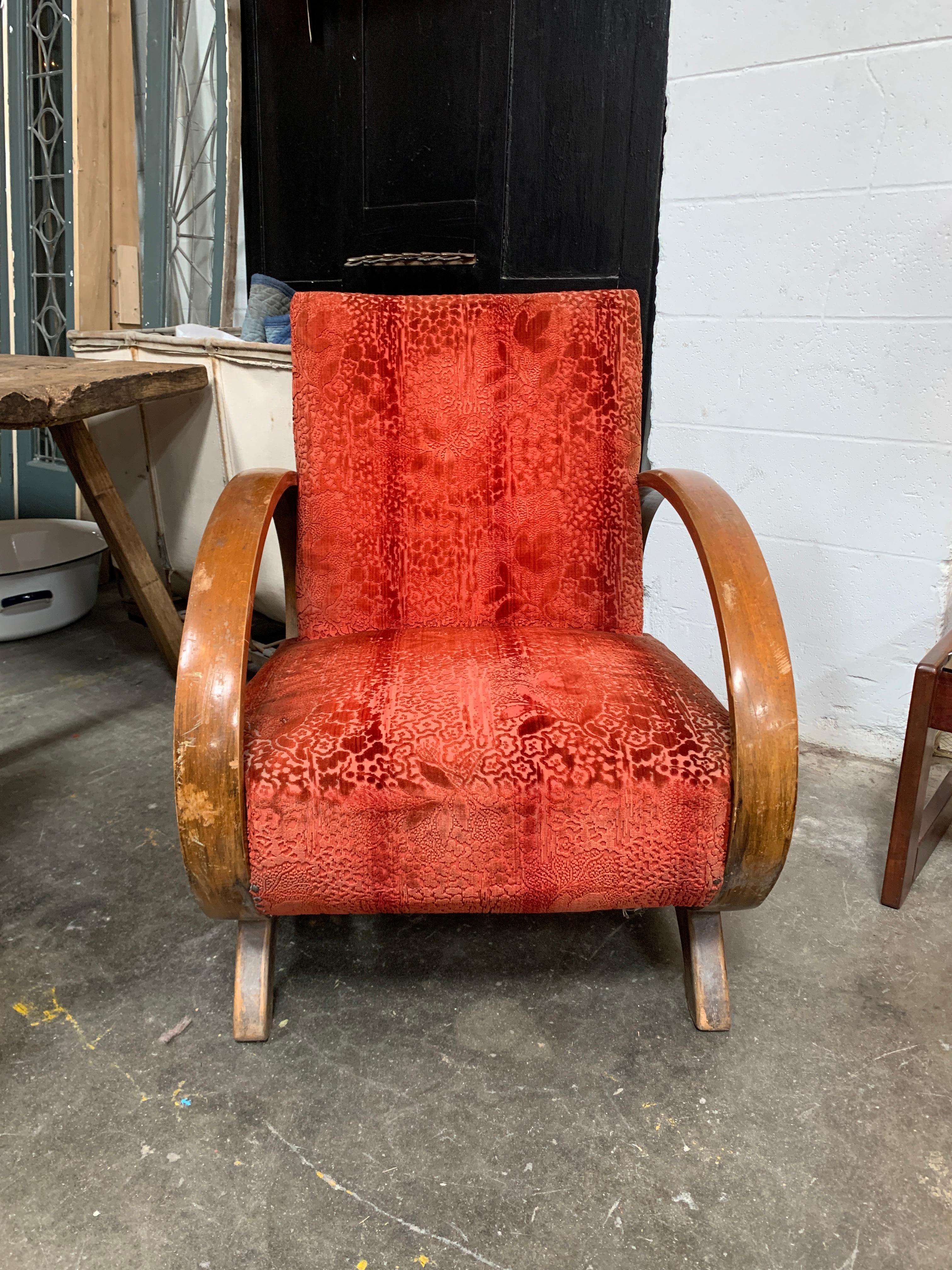 A truly unique Art Deco Club chair with exaggerated Oval arms. Original upholstery, springs and finish.