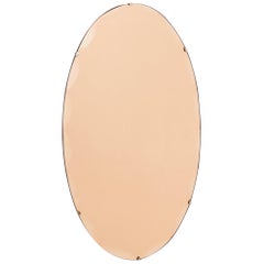 Vintage Art Deco Oval Peach Glass Mirror with Scolloped and Beveled Edge, circa 1930