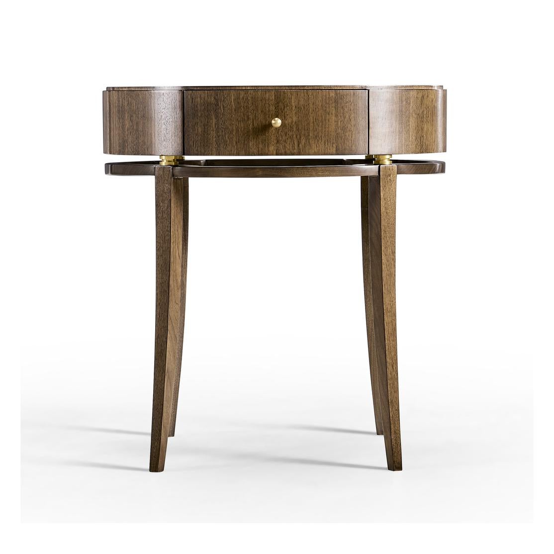 Art Deco oval walnut bedside table, crafted from the finest American walnut, with a hand-rubbed lacquer finish, is a true masterpiece. The top of the table features an eight-piece radial book match veneer pattern, adding a touch of elegance to any