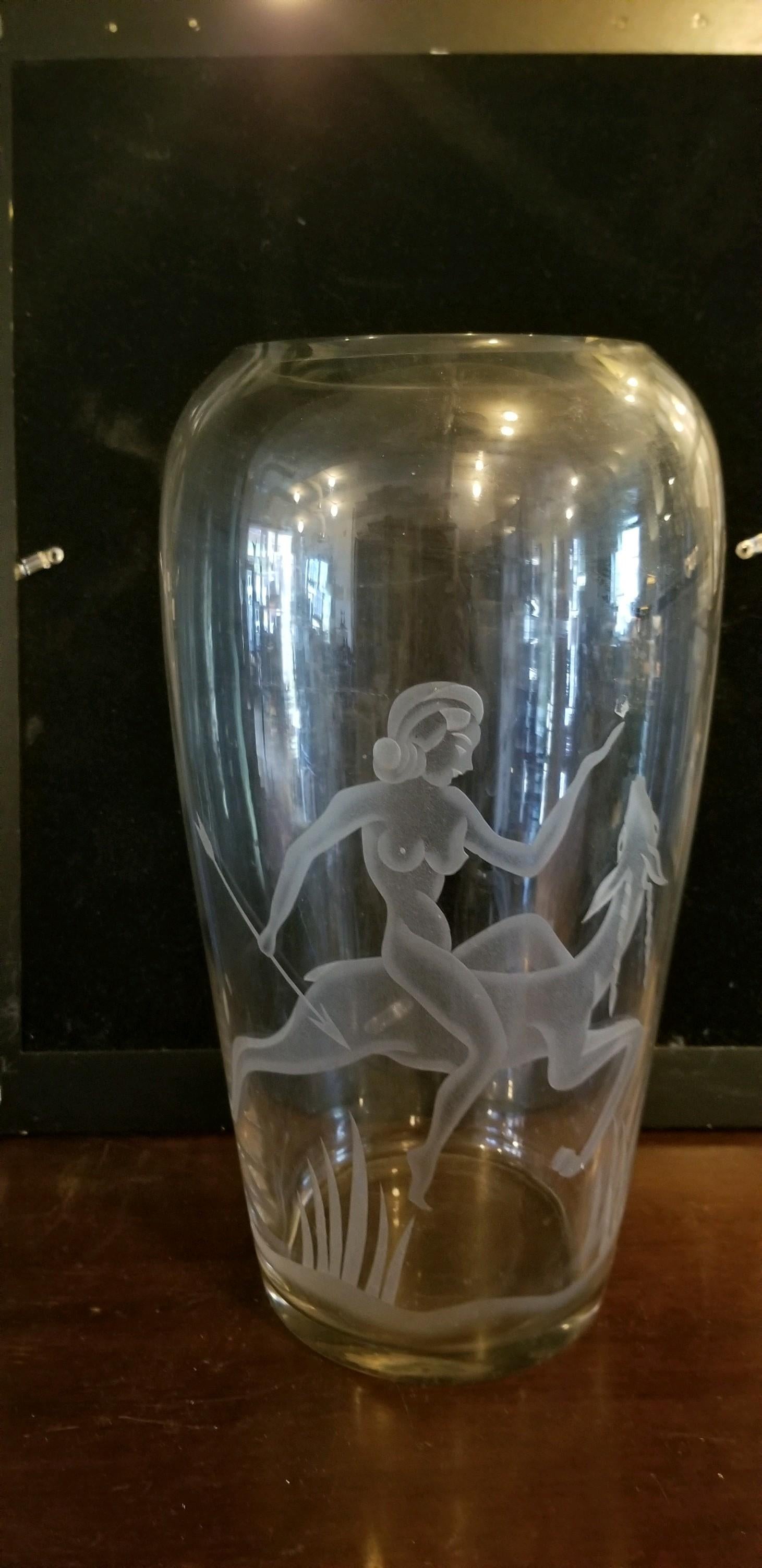 Art Deco oversized etched glass vase is a Classic Art Deco Art Deco motif of woman riding deer. All through glass the etching makes this vase stand alone or become part of your flower scape for your home. 1925-1940 good condition with wear
