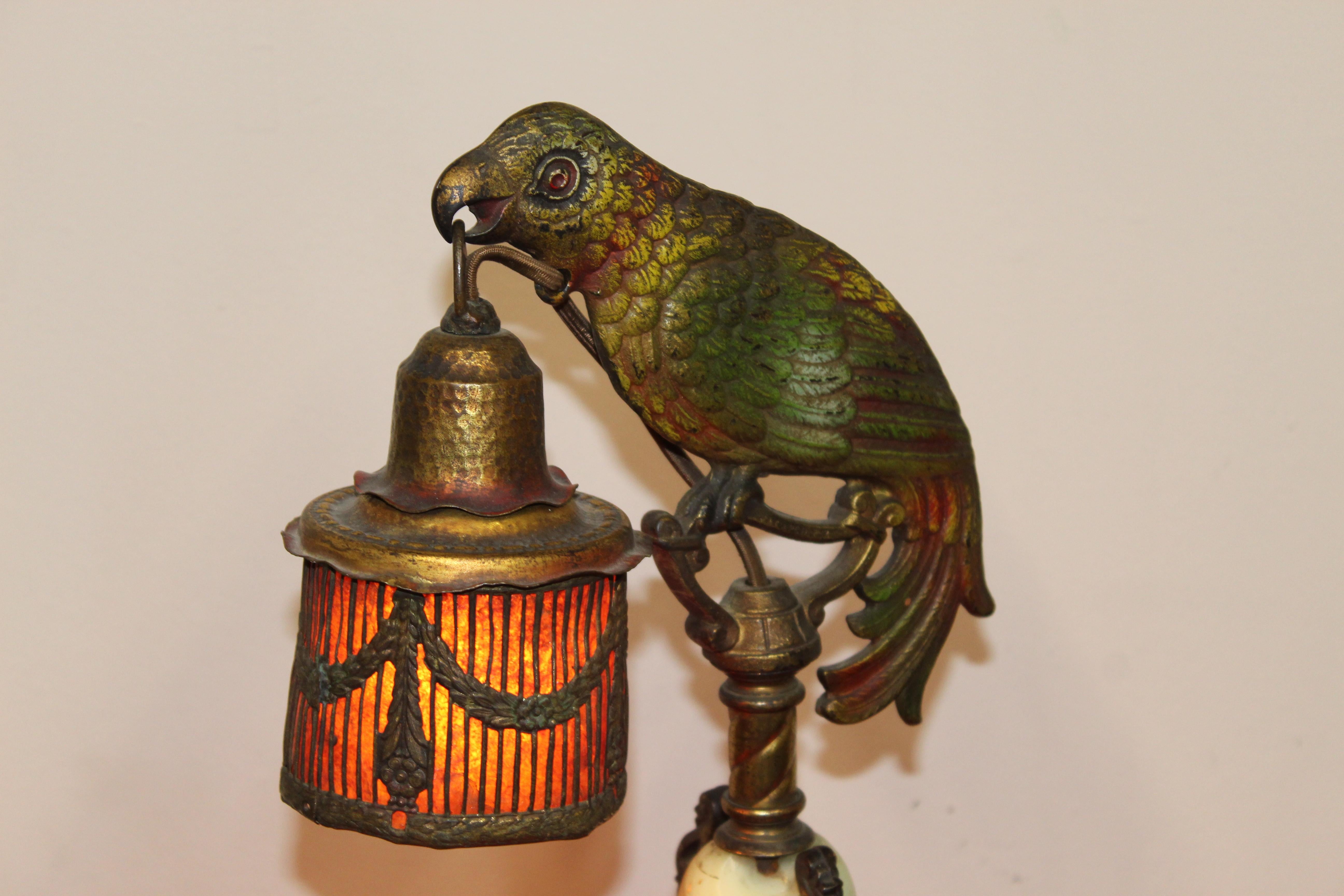 All original condition. Painted cast metal parrot lamp with a cage shade. Giant green onyx ball, which has a crack on one side near the top. This lovely, antique parrot lamp is a proposition for all vintage enthusiasts. Over all in good original