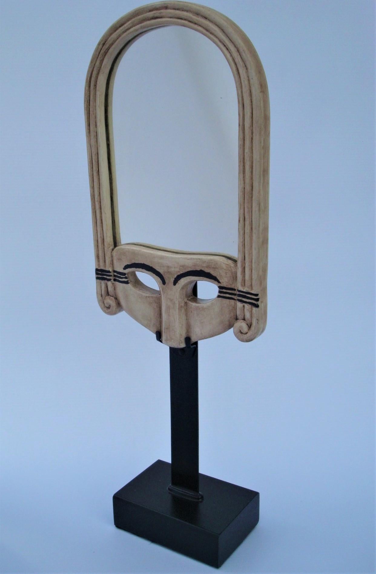 Albert Binquet
Hand mirror, circa 1921
Made of wood, painted in ivory color, representing a stylized mask, the eyebrows and outer edges of the eyes underlined with black paint
Measures: Height: 24 cm. (91/2 in.) ; Width: 14 cm. (51/2 in.)
Signed
