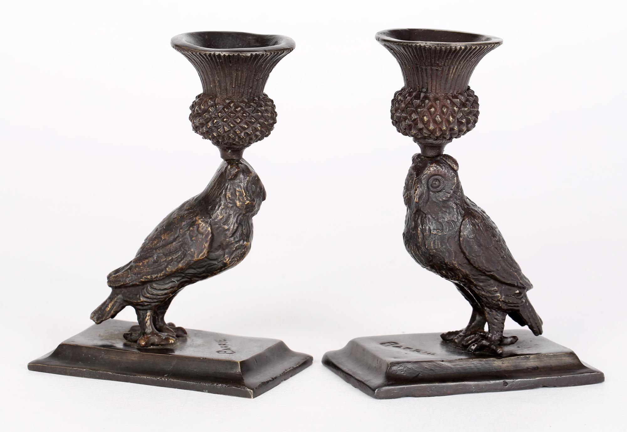 A good Art Deco pair bronze candlesticks modelled as owls with thistle shaped sconces dating from around 1920-30. The candlesticks are mounted on rectangular stepped bases and are well detailed as standing owls with thistle flower candle holders