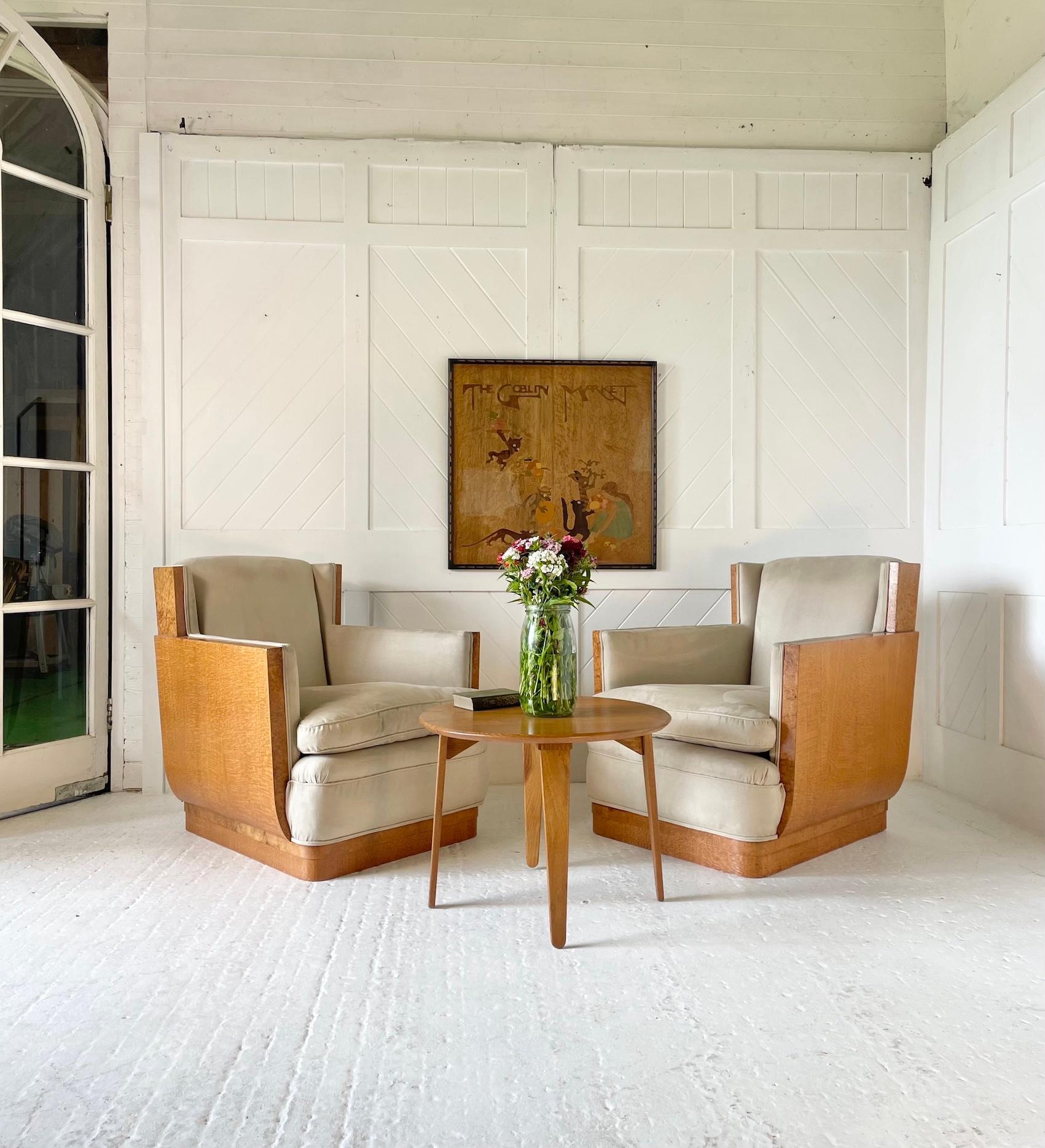 Art Deco pair of armchairs

Constructed in silky oak and covered in a faux suede fabric

Attributed to Serge Chermayeff
Waring & Gillow
 
Circa 1920s

Height 82cm.  Width 78cm.  Depth 80cm.  Seat Height 40cm

Towards the end of the 1920s Waring &