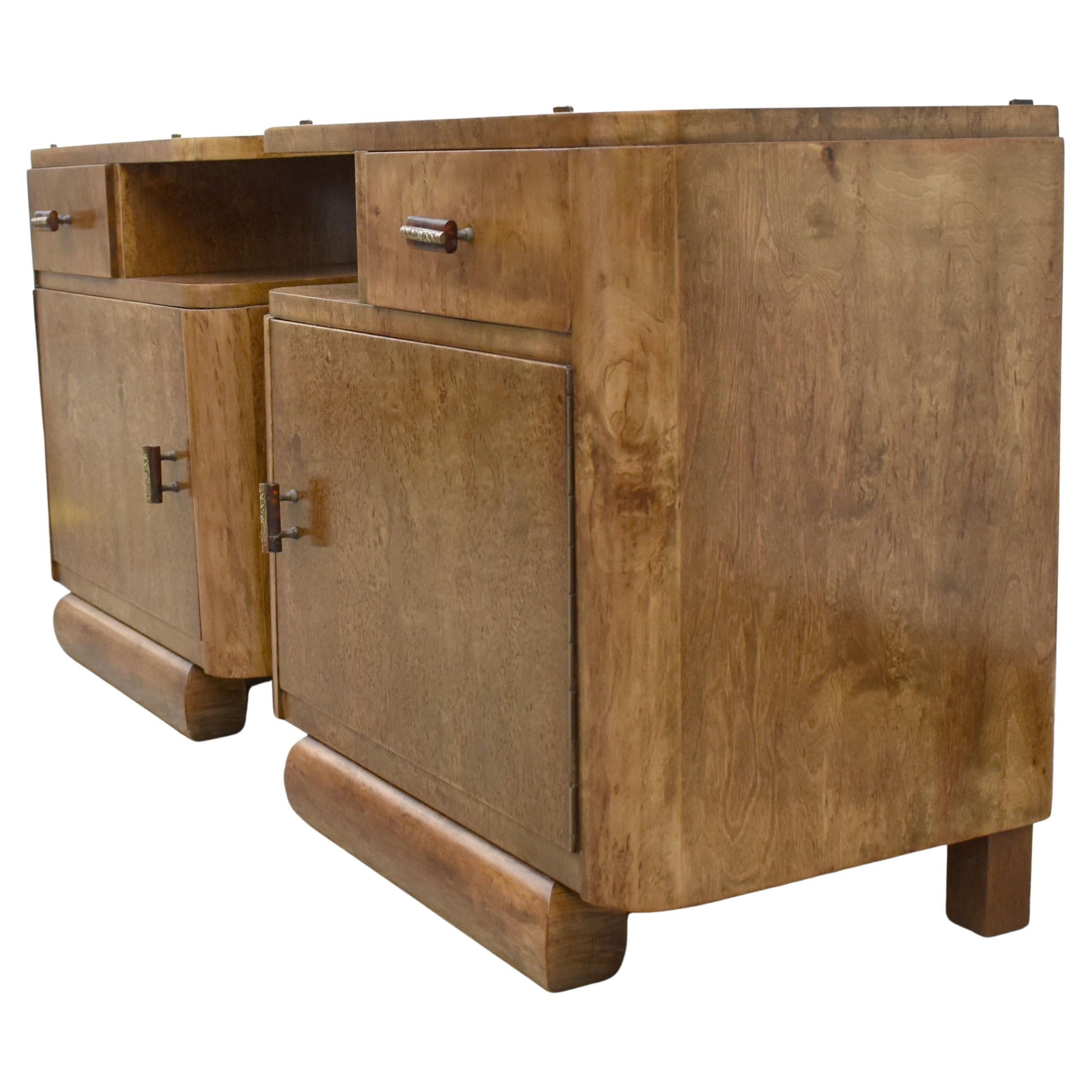A rare opportunity to acquire high styled and totally original Art Deco bedside tables. Originating from France and dating to the early 1930's they fill both the highly desired shape of Art Deco at its best and sort after the luscious veneers of