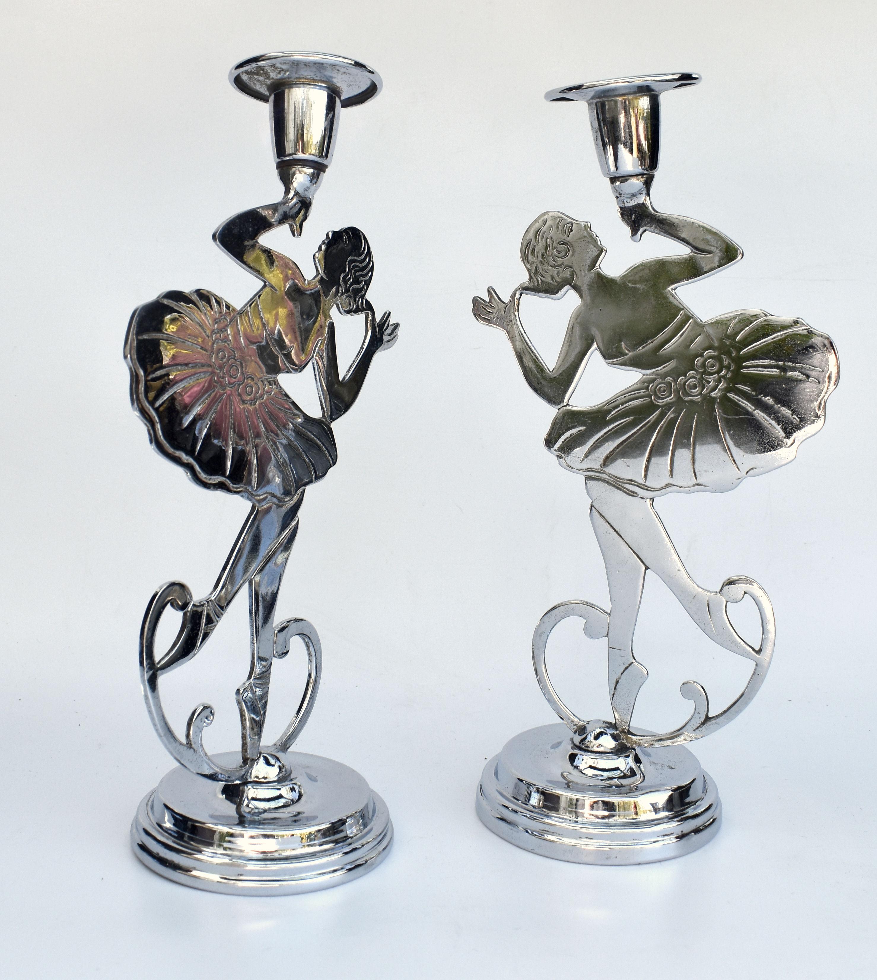 For your consideration are there matching pair of highly collectable 1930s chrome Art Deco double candlesticks featuring two dimensional dancing girls . Condition is great with minor clues to the real age. These are a very stylish product of the