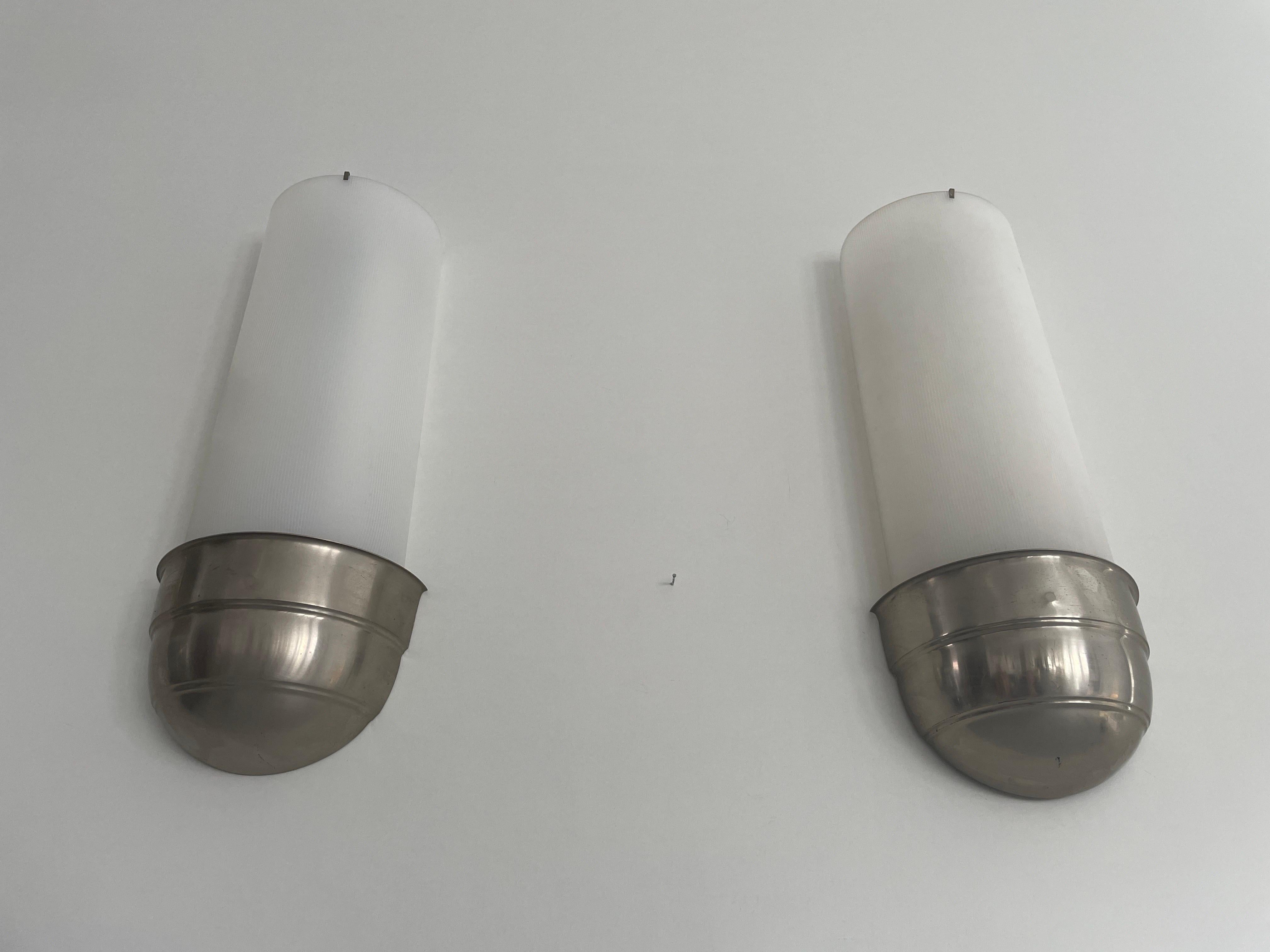 Art Deco Pair of Cinema Sconces, 1940s, Germany

Very nice high quality wall lamps

Plexiglass shades. chrome bases

Lamps are in very good vintage condition.

These lamps works with Halogen Fluorescent tubes POSRAM-L / 16W / 25V
Wired and suitable