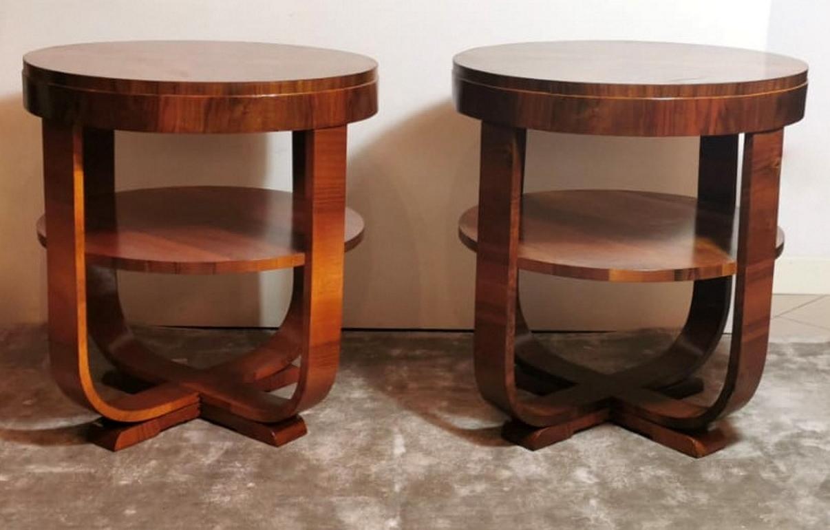Beautiful and important pair of Art Deco tables; they have been handcrafted in first quality walnut wood between 1930 and 1933 in Austria; they have two round tops, the upper one is the primary support surface, while the other second one contributes