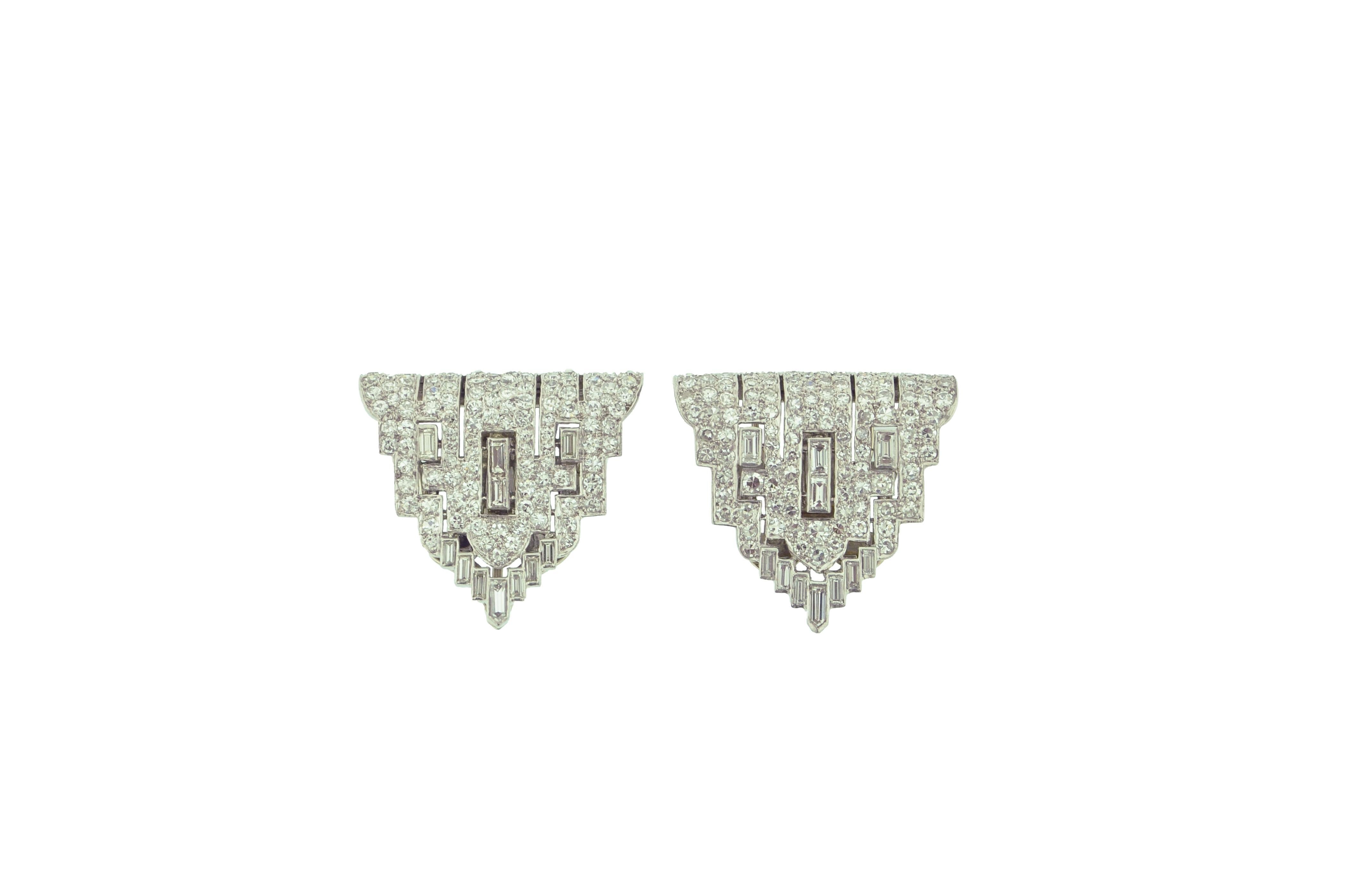 These beautiful clips are very versatile as they can be used as either clips or converted into a brooch. This Art Deco piece was crafted with Platinum and 14 Karat White Gold. With a mix of baguette and round diamonds, there's a total of 220
