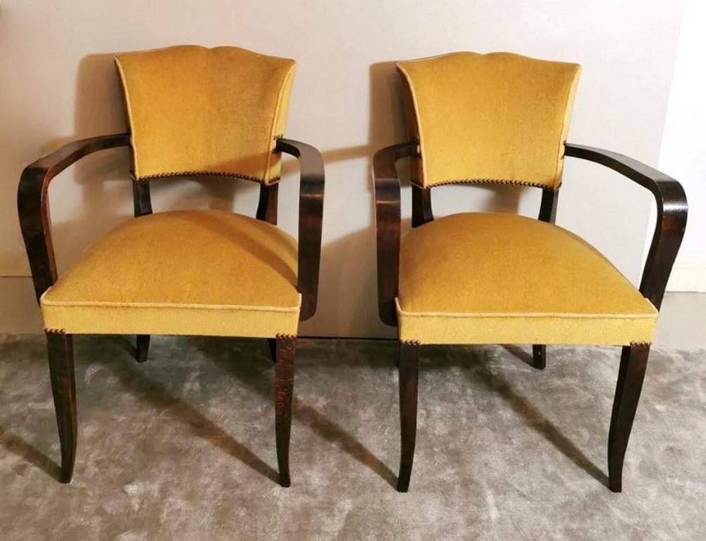 Beautiful and elegant pair of French chairs; they are made of sturdy and precious oakwood; their structure is extremely solid, in fact, the back legs form a single piece with the backrest, while the armrests and front legs, even if they have a slim