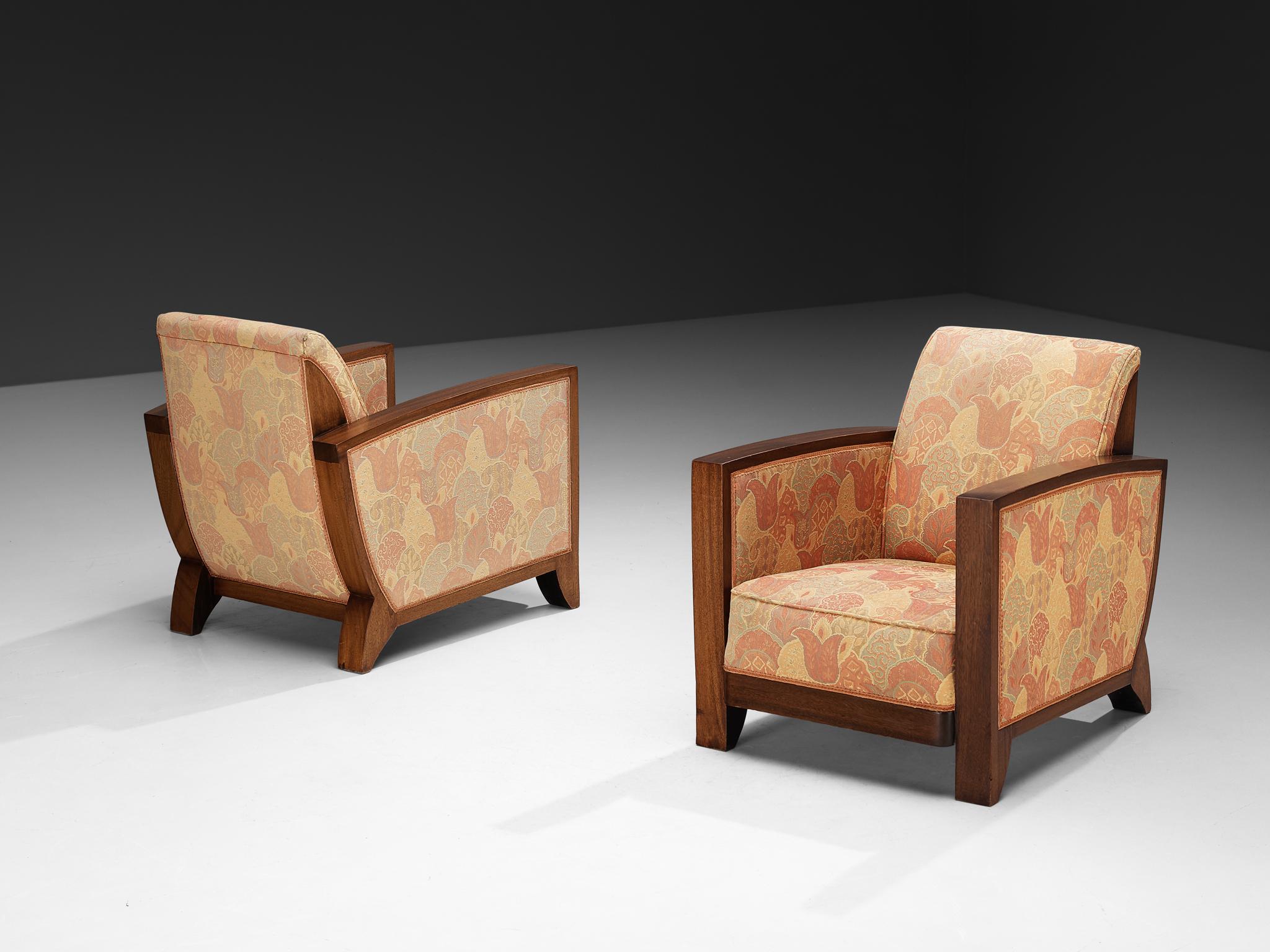 Pair of armchairs, mahogany, fabric, Europe, 1940s

This European set of armchairs from the 1940s reflects the influence of Art Deco design. The frame, executed in mahogany, is defined by clean lines and solid construction. Broad armrests extend
