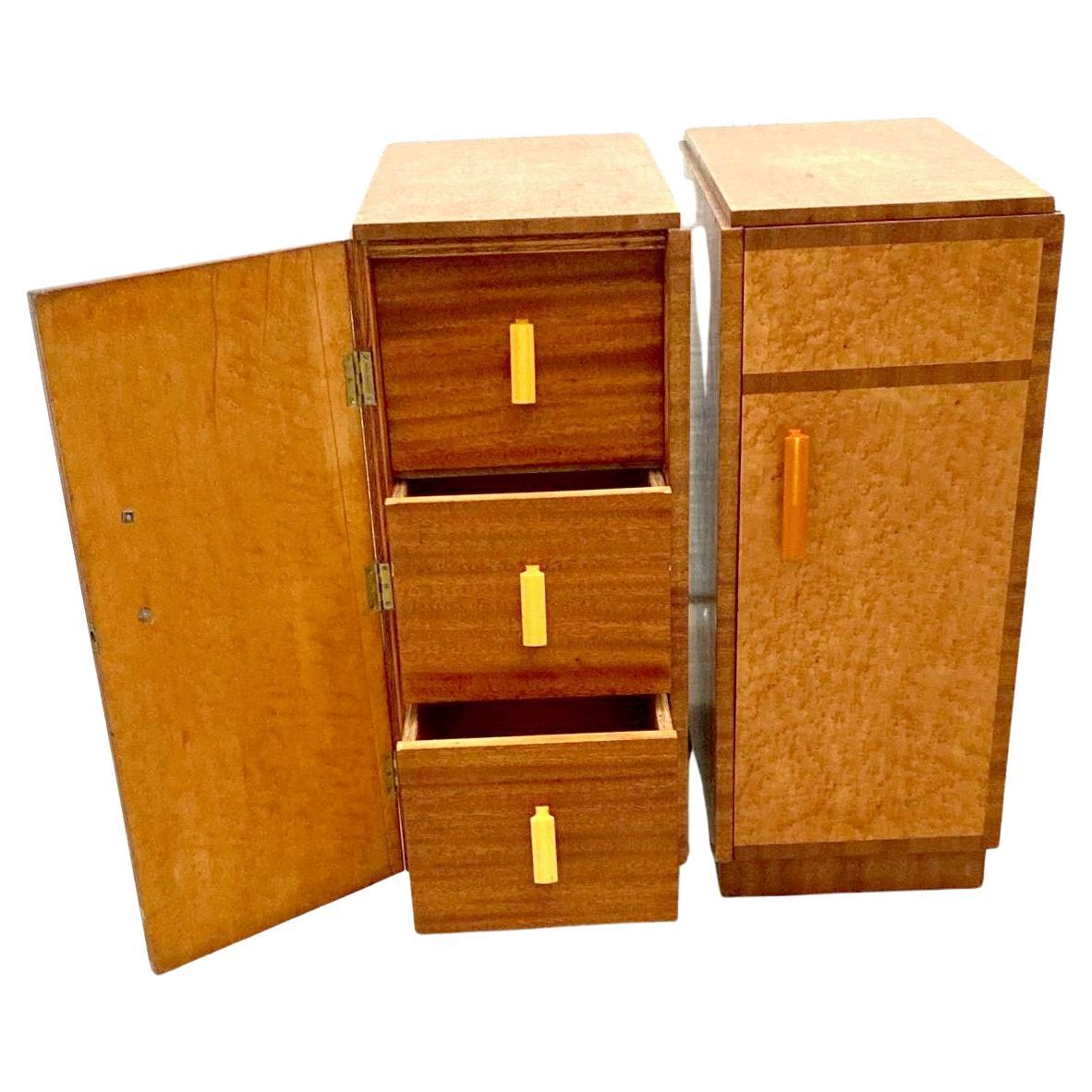 Fabulous pair of matching 1930s Art Deco bedside cabinet tables in a lovely true blonde bird's-eye maple on a walnut plinth and banding. These cabinets originate from England and feature a single door which opens to three pull out drawers. All with