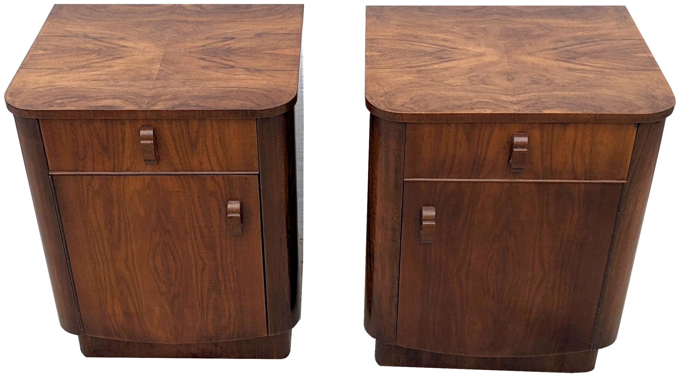 Pair of walnut original Art Deco bedside tables. Originating from England and dating to the early 1930's they fill both the highly desired shape of Art Deco at its best and sort after the luscious veneers of figured walnut veneers. A wonderful