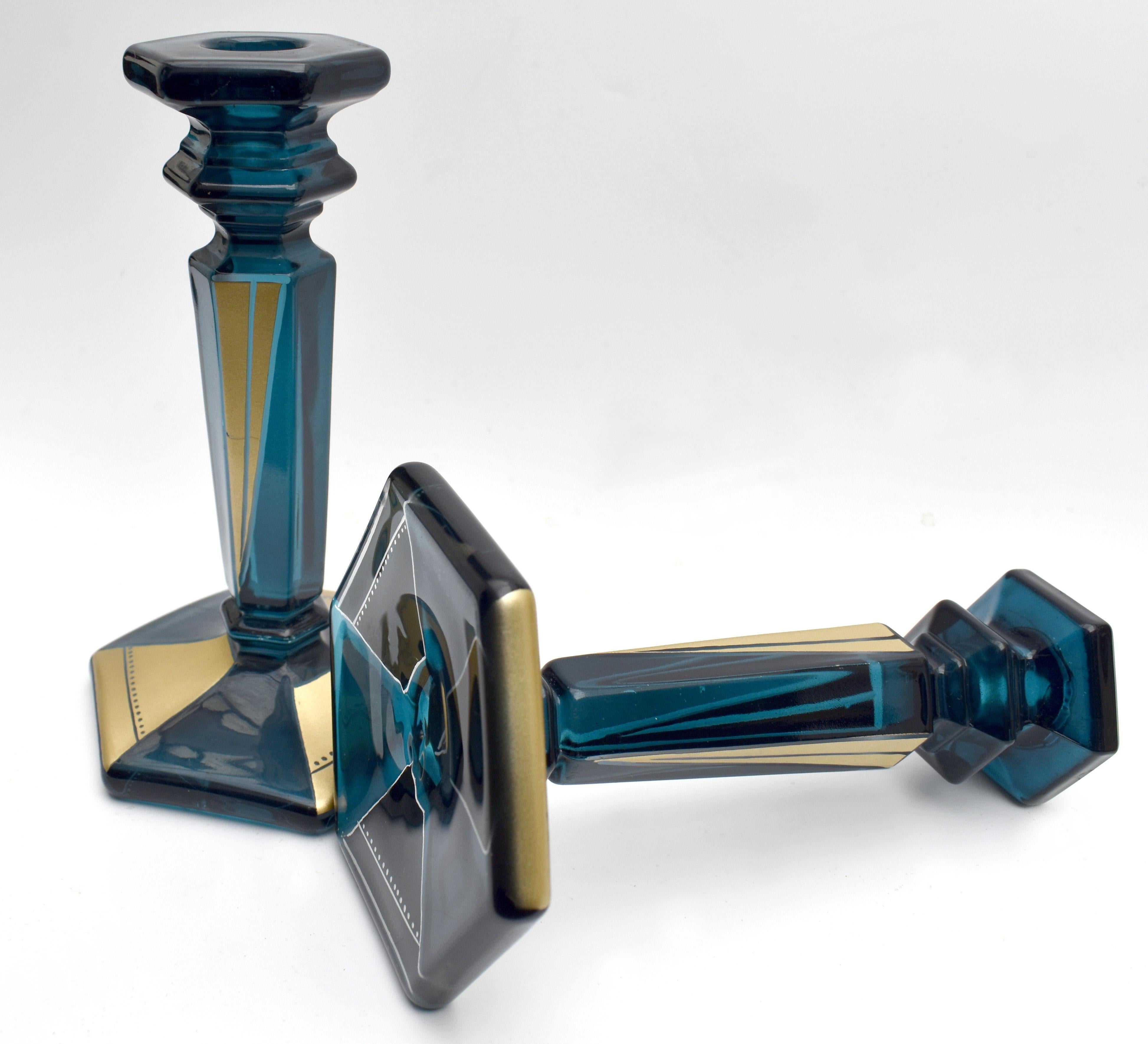 Superbly stylish and good sized pair of matching 1930s Art Deco candlesticks. Lovely condition and one Art Deco admirers will appreciate. Blue glass with an over lay of gold enamel geometric decoration with etching all in again lovely condition free