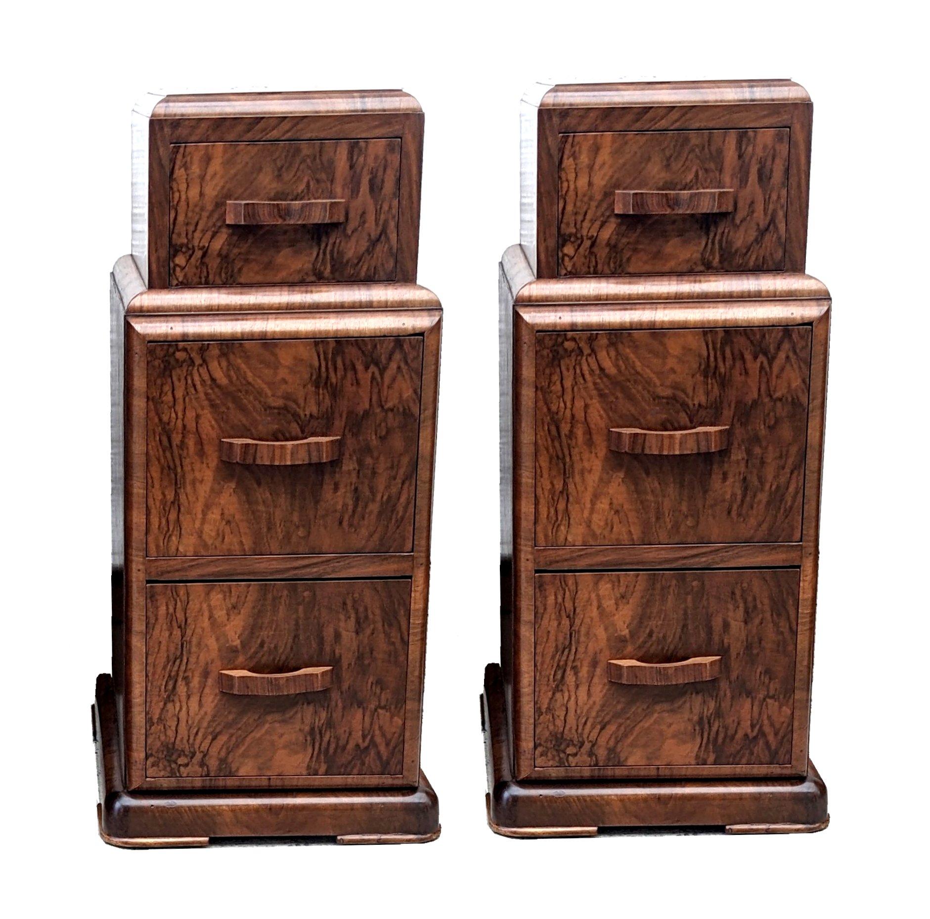 A good opportunity to acquire a fabulous matching pair of walnut Art Deco bedside tables. Originating from England and dating to the early 1930's they fill both the highly desired shape of Art Deco at its best and sort after the luscious veneers of