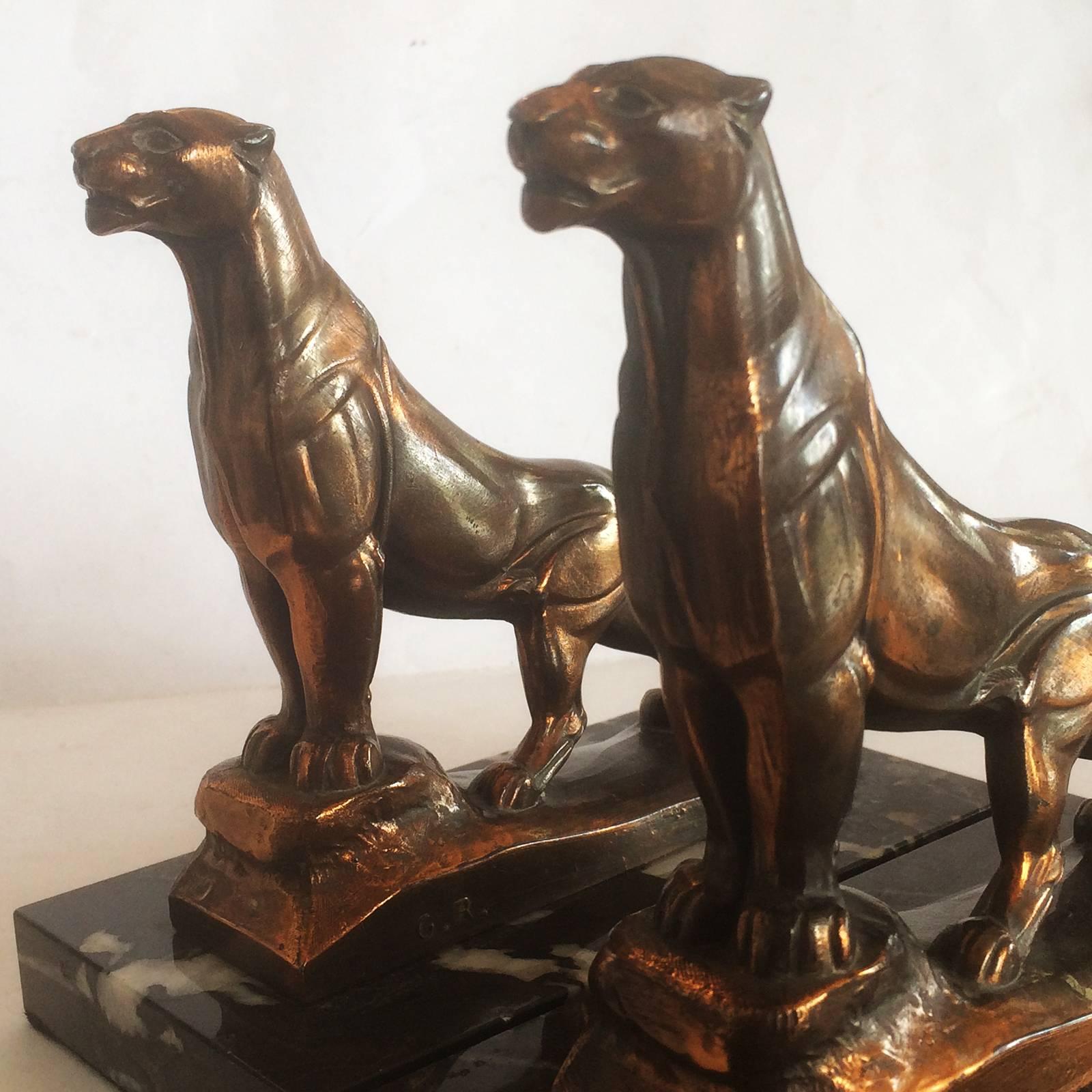 Art deco bookends panthers by Maurice Frecourt in Fonte D’arte, and signed to the side plinth of each Frecourt and on the reverse G.R. and France. Both are perfect and great attention to be atomically correct. Finished with a japanned black and