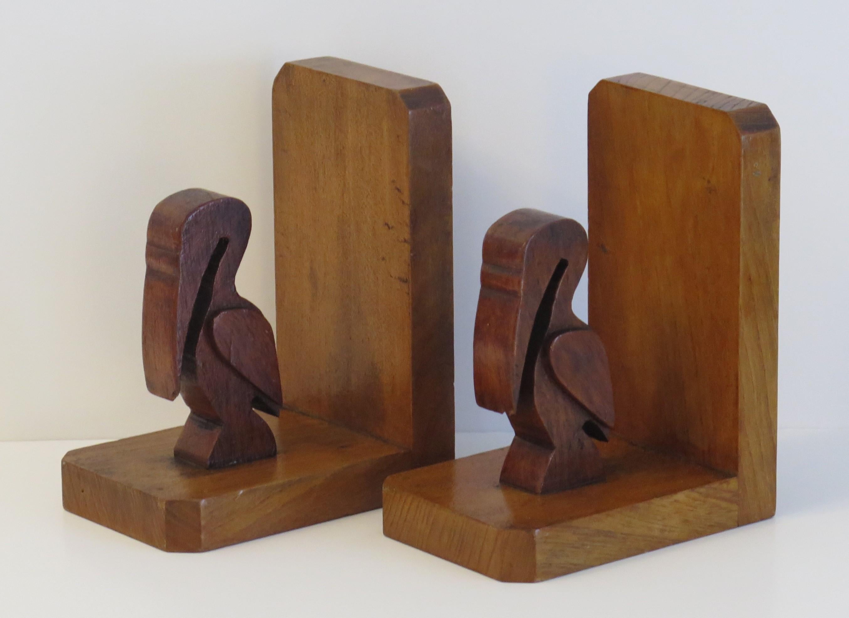 Hand-Crafted Art Deco Pair of Pelican Figure Bookends in Hand Carved Woods, circa 1930 For Sale