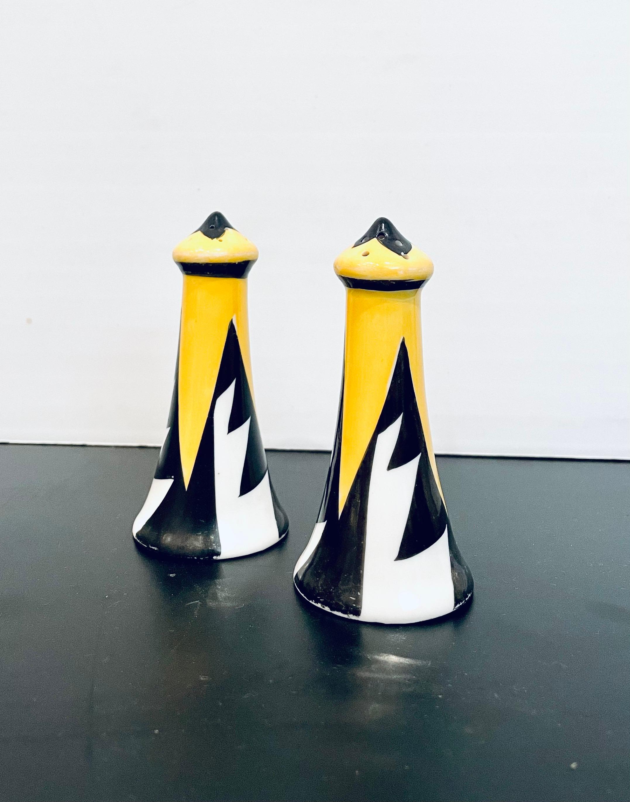 Beautiful pair of ceramic salt and pepper shakers in a porcelain finish, great design, and colors circa 1940s no chips or cracks.
