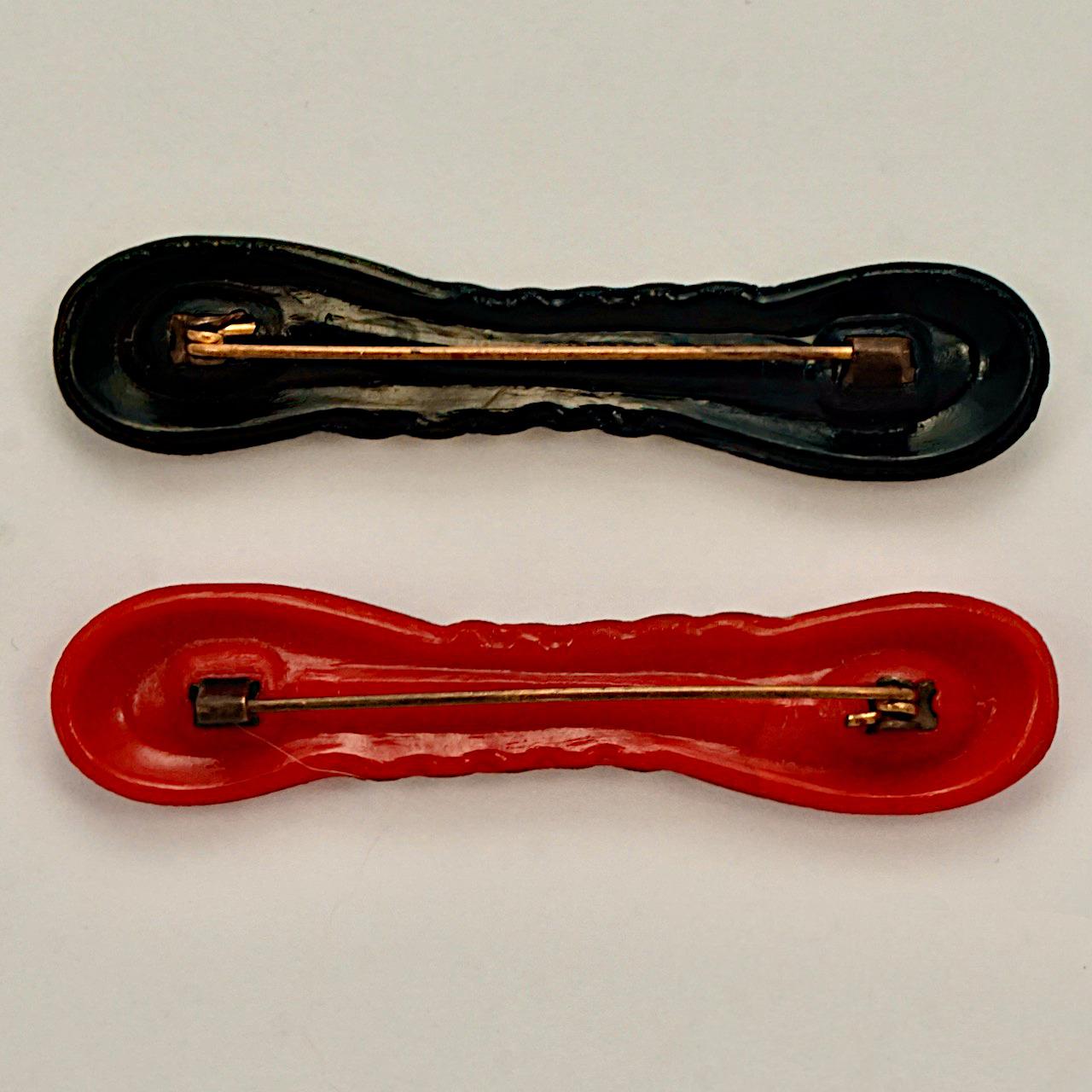 Women's or Men's Art Deco Pair of Red and Black Glass Bow Brooches with Silver Tone Highlights For Sale