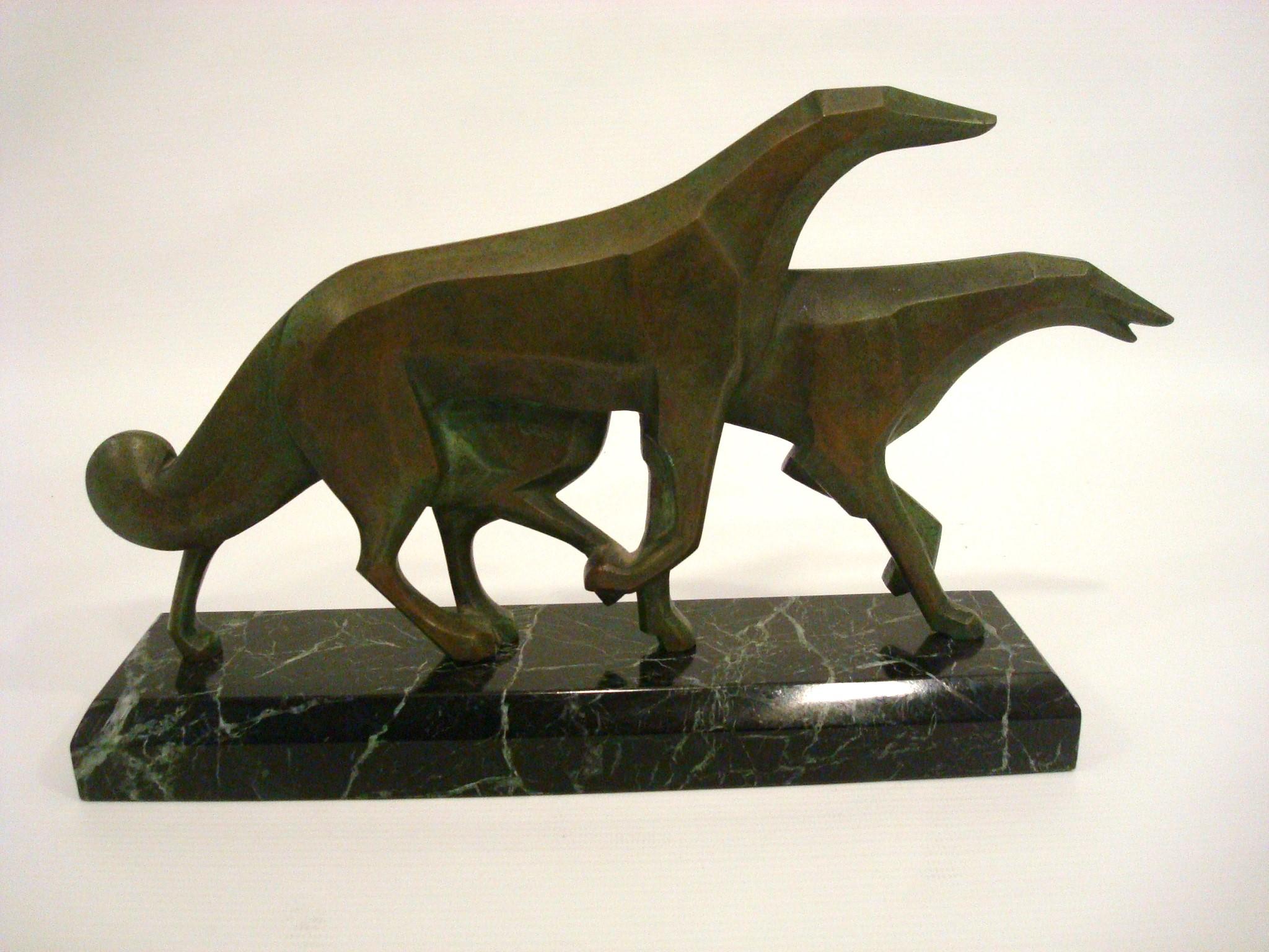 Art Deco Pair of Russian Borzoi Bronze sculpture. P. Rossi Italy 1950´s.
High Quality Bronze Sculpture of a pair of dogs, mounted over a green marble base. Very nice to use as a paperweight on a desk.

The Borzoi or Russian Hunting Sighthound is a