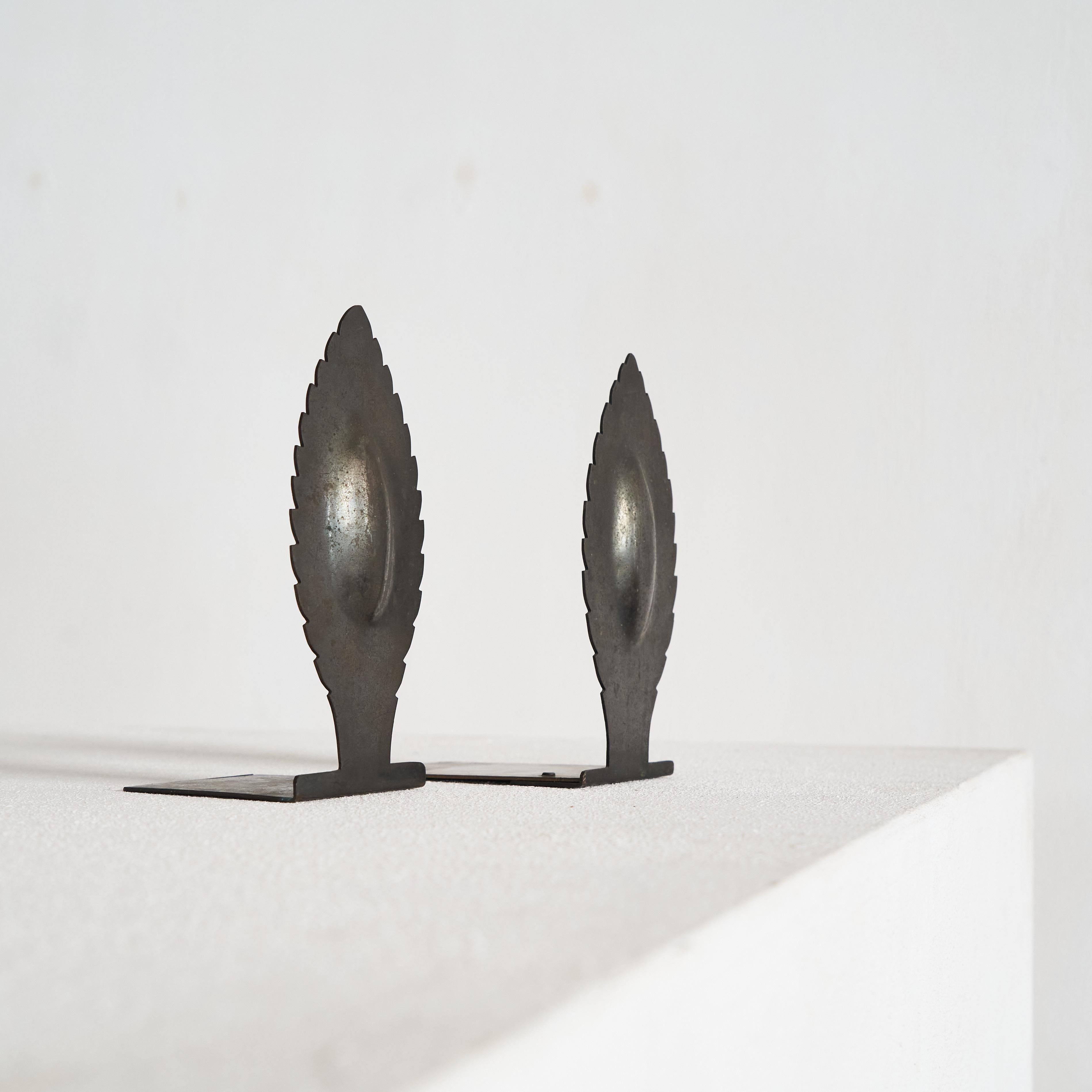 Art Deco Pair of Sculptural Bookends 1930s.

Beautiful pair of art deco bookends with a sculptural shape, made somewhere in the early part of the 20th century. Art Deco / Amsterdamse School style. 

Great execution and details - but overall the