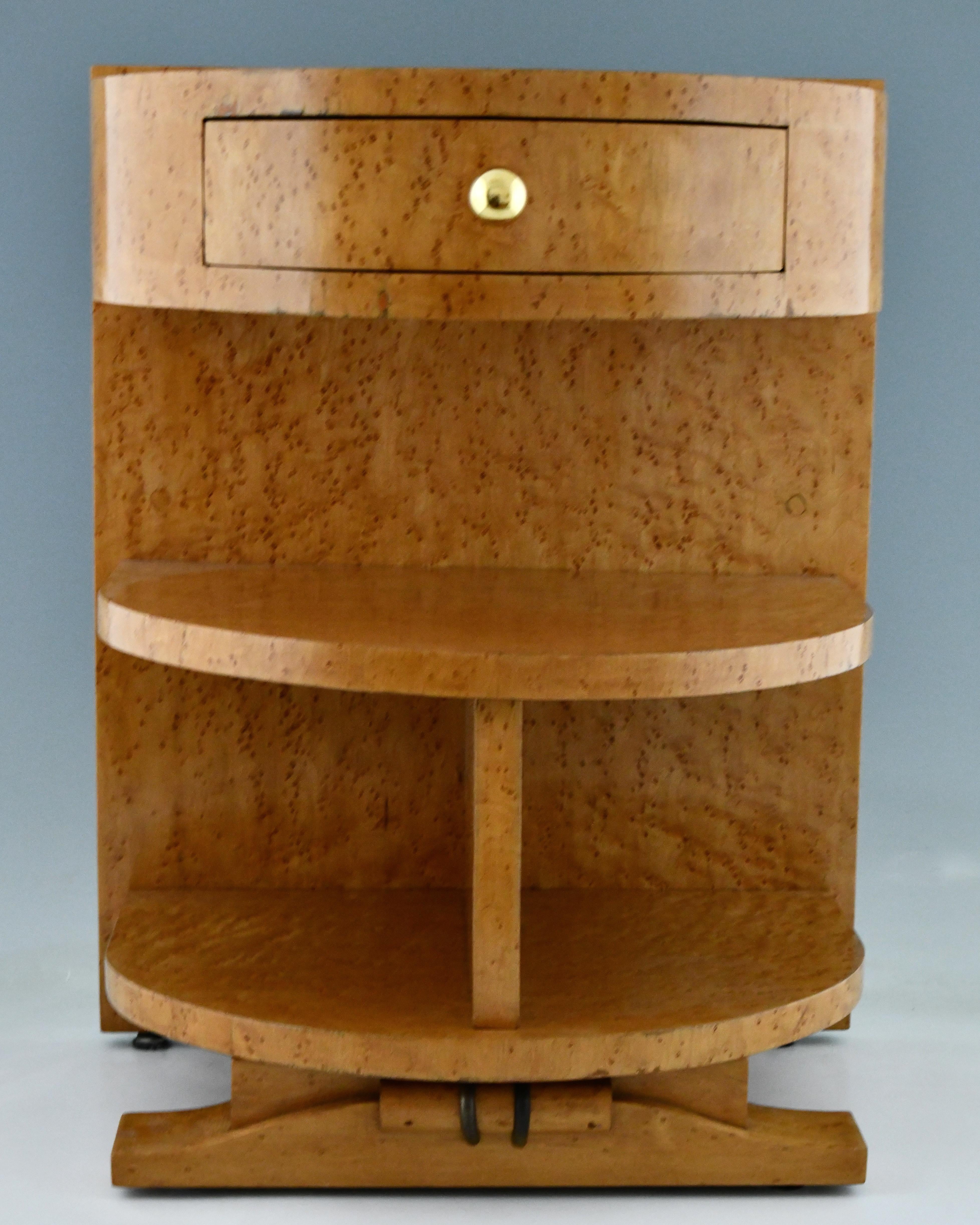 Pair of Art Deco semi circle bedside tables or night stands, birdseye maple veneer on wood. Open shelve and single drawer. One with a door. Brass handles and details. France, 1930.