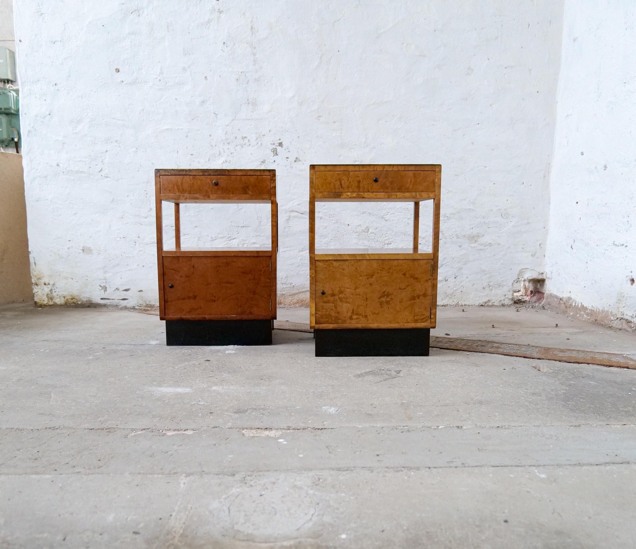 Pair of beautiful bedside tables attributed Carl Malmsten. Made in alder root. Legs and table rounded in manners of the art deco period. The legs and top have blackened parts and the structure is nicely put together with nicely laid wood. The top of