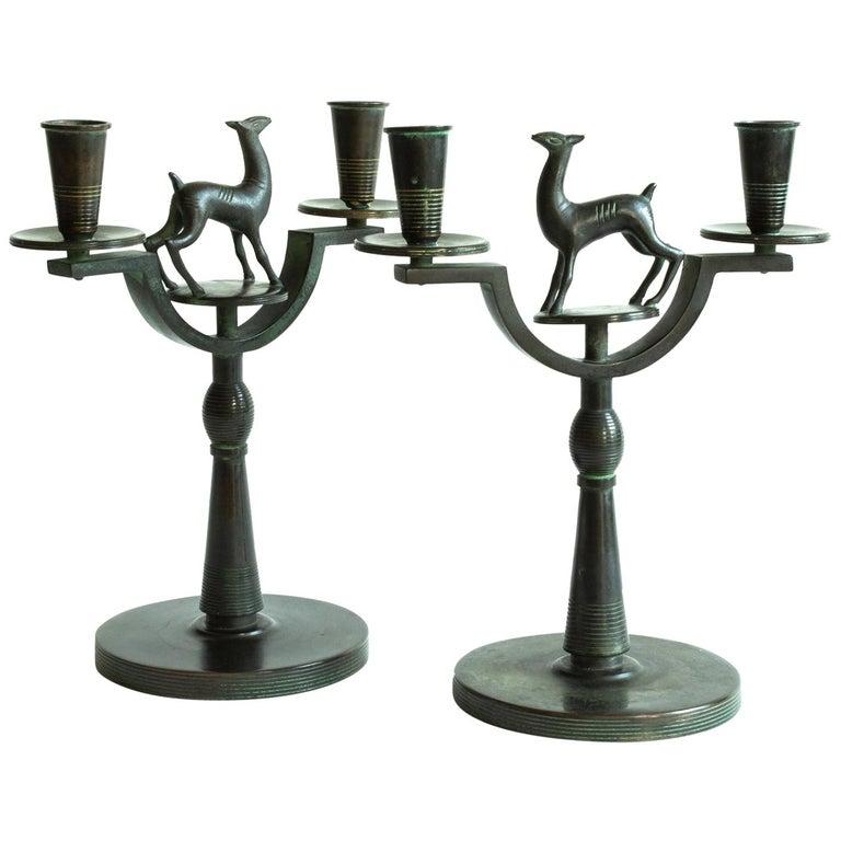 Very rare Art Deco pair of Swedish modern candelabras signed by Nils Fougstedt in bronze. Probably made between 1920-1935.
Nils Fougsted had several assignments for Firma Svenskt Tenn and the owner Estrid Ericson. These candelabras are made for