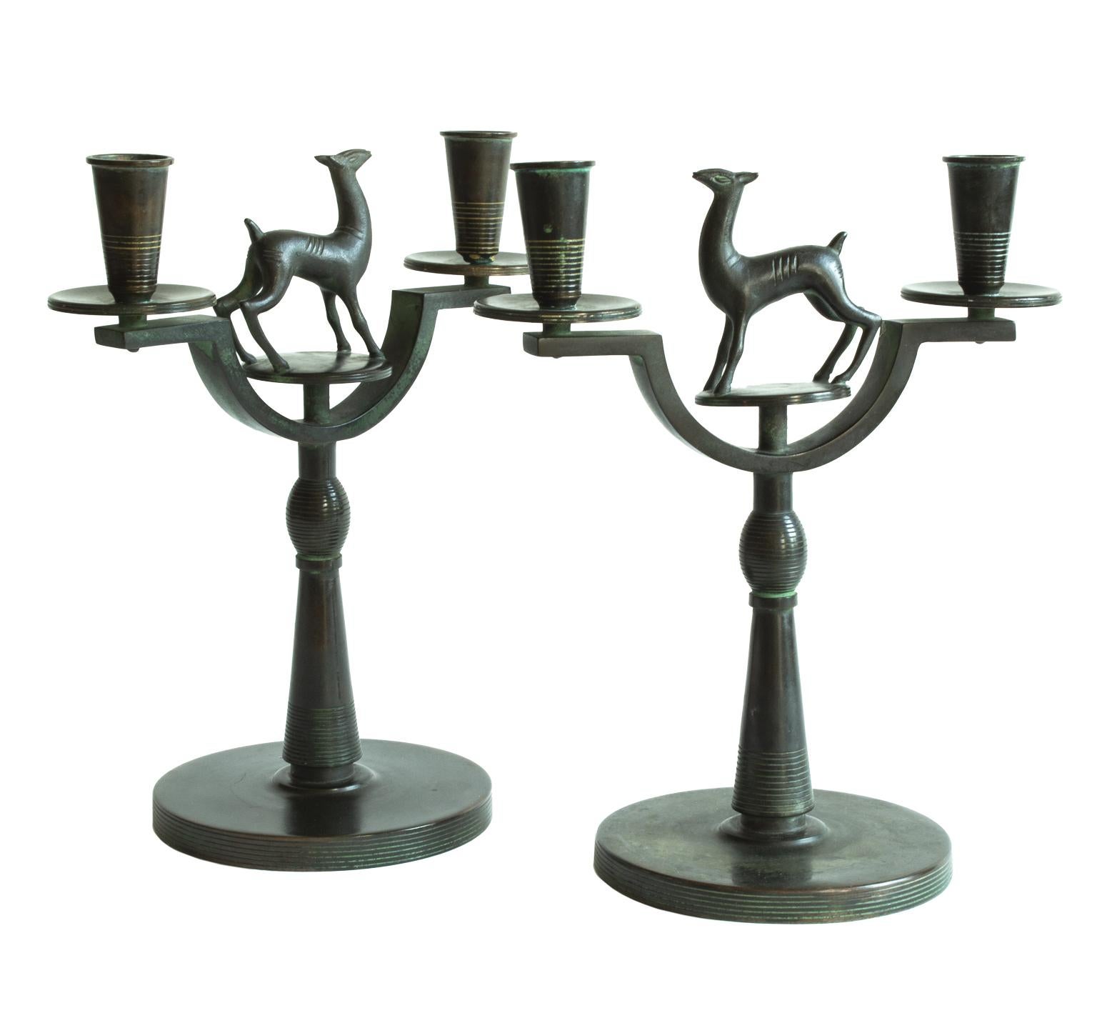 Very rare Art Deco pair of Swedish modern candelabras signed by Nils Fougstedt in Bronze. Probably made between 1920-1935.
Nils Fougsted had several assignments for Firma Svenskt Tenn and the owner Estrid Ericson. These candelabras are made for