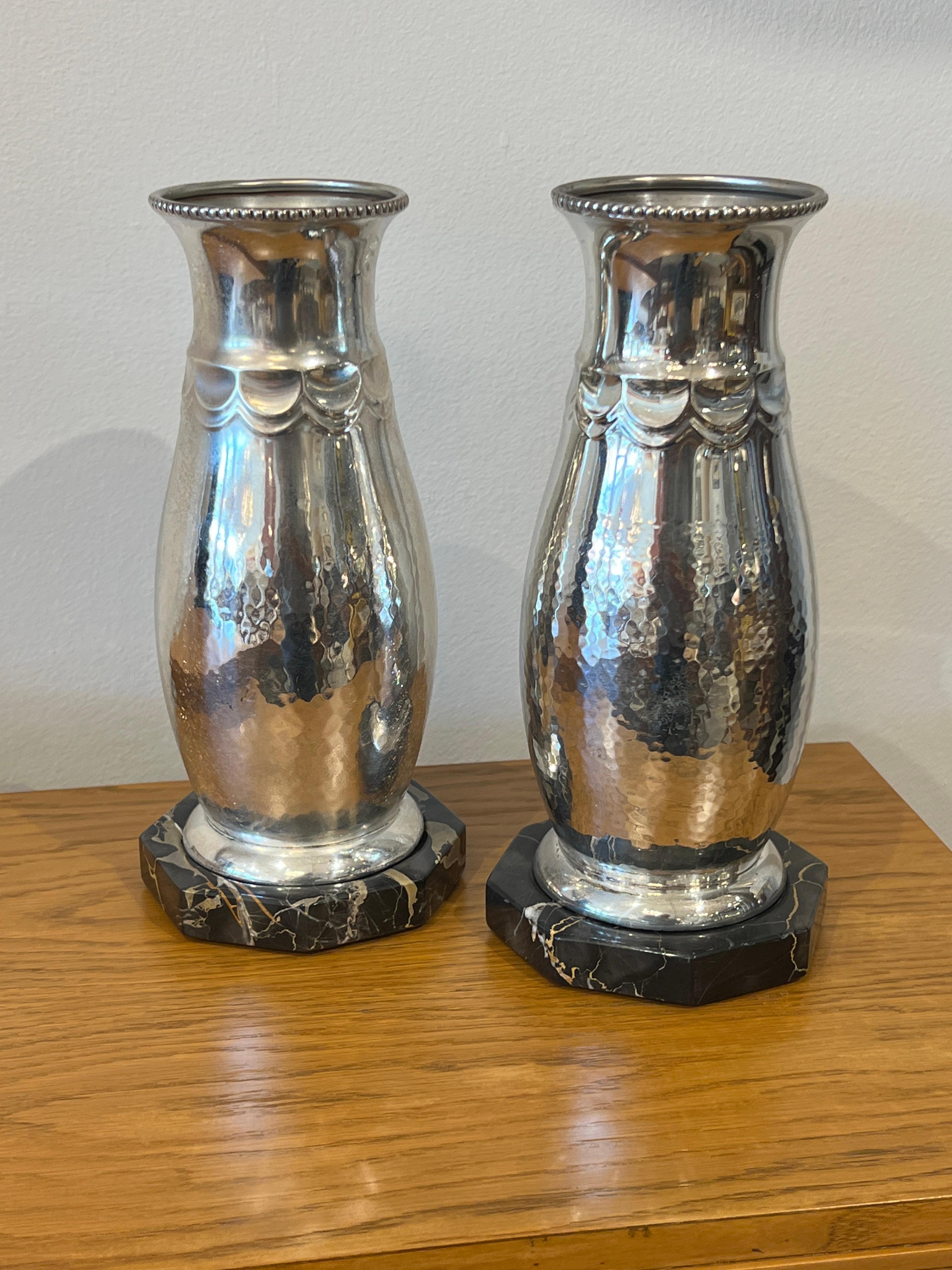 A pair of Beautiful Art Deco Silver Plated vases with portoro Marble bases.
Made in Gernany
Made in Circa: 1930