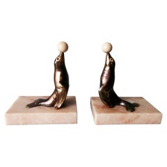 Used Art Deco Pair of Spelter Seal Bookends with Fine Marble Base