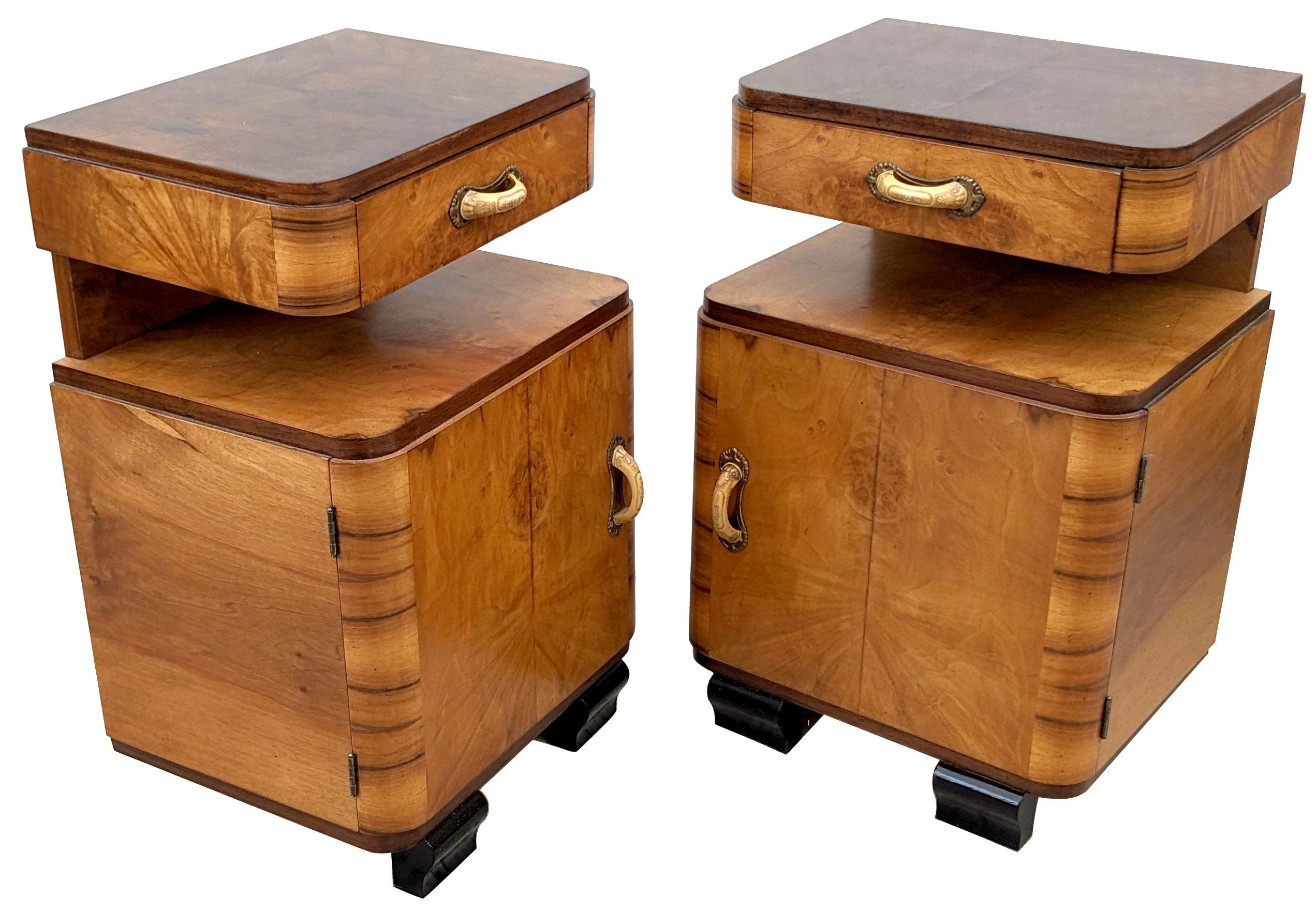 A rare opportunity to acquire a wonderful pair of matching and original Art Deco bedside tables. Originating from Italy and dating to the early 1930's they fill both the highly desired shape of Art Deco at its best and Blonde walnut which so easily