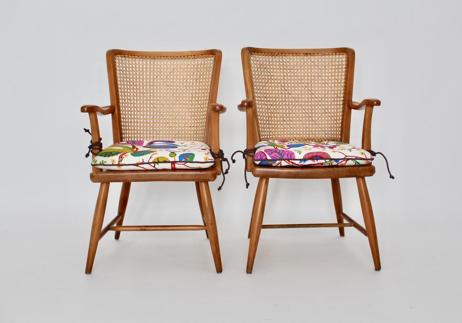 Art Deco two armchairs from ash wood and Viennese mesh by Josef Frank, Vienna circa 1928.
The armchairs show a Viennese mesh structure at the back. Furthermore the armchairs features slightly curved armrests.
The loose cushions are renewed by hand