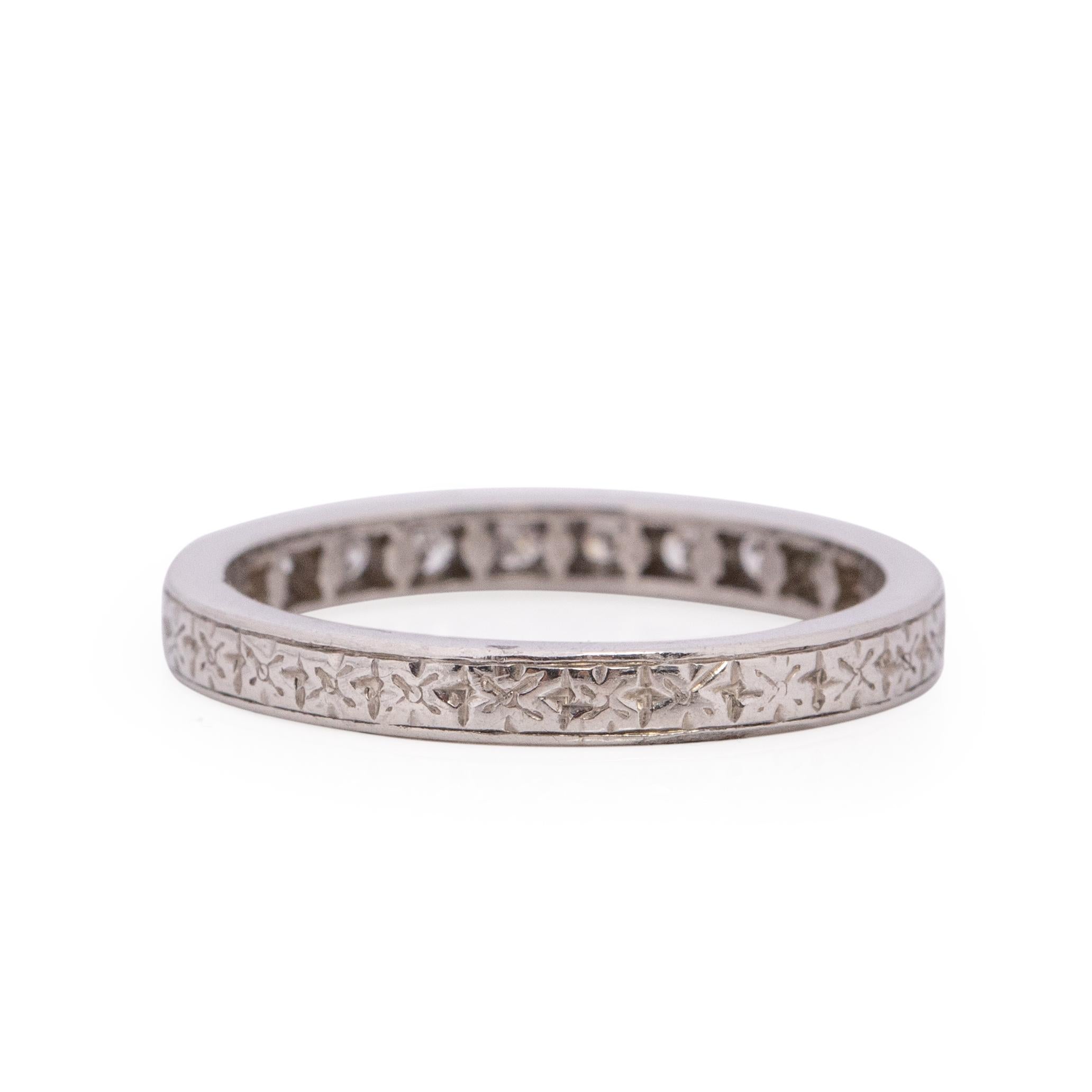 Here we have a genuine Art Deco era band crafted in palladium! This is a great example of a vintage diamond band maintaining most of the excellent etching work original to the ring. This beautiful ring is accented with 10 chunky early old European
