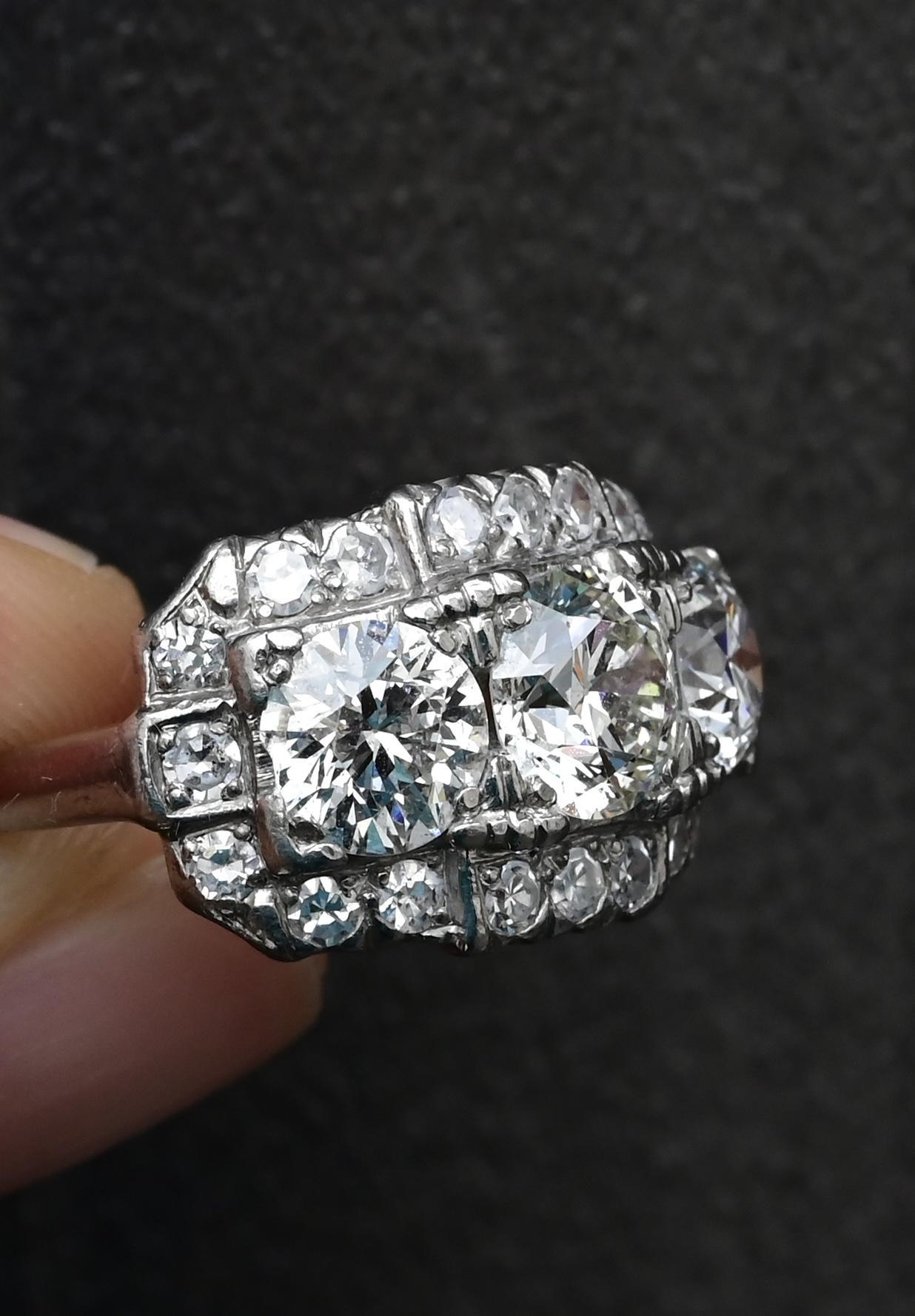 Art Deco Palladium Ring IGI Certified 3.75ct Diamond Total – 1.25ct Center Round Brilliant + 1.84ct Old Euros + Single Cuts 

 This stunning IGI-certified Art Deco ring is a rare and collectible piece of fine jewelry crafted in palladium, weighing