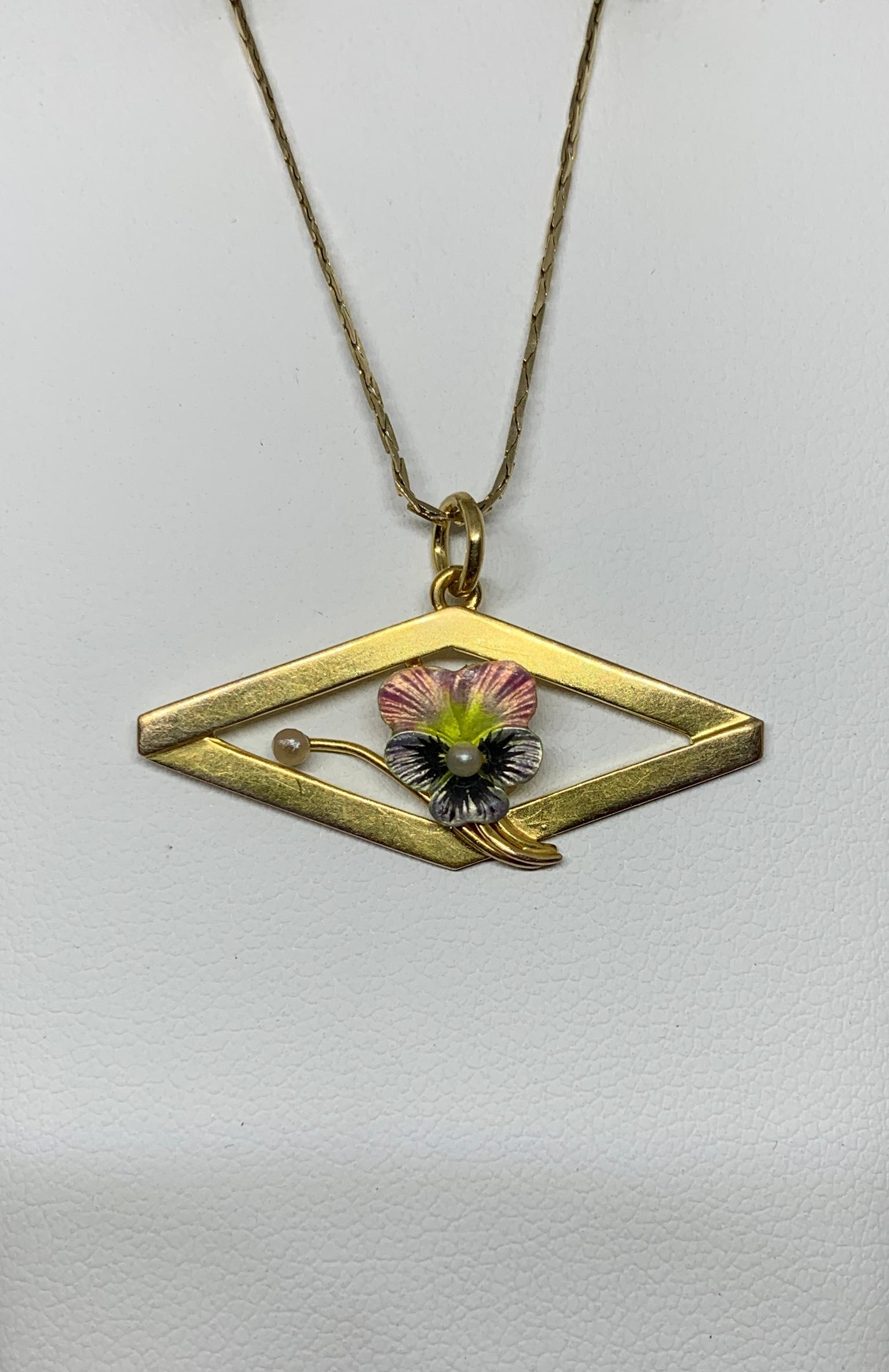 THIS IS A GORGEOUS VICTORIAN - ART DECO PENDANT WITH A BEAUTIFUL PINK AND BLUE ENAMEL PANSY FLOWER WITH A PEARL IN THE CENTER AND SET AS A FLOWER BUD.  THE FLOWER IS SET IN AN ELEGANT GOLD SURROUND WITH LOVELY ART DECO DESIGN.  THE PENDANT IS 10