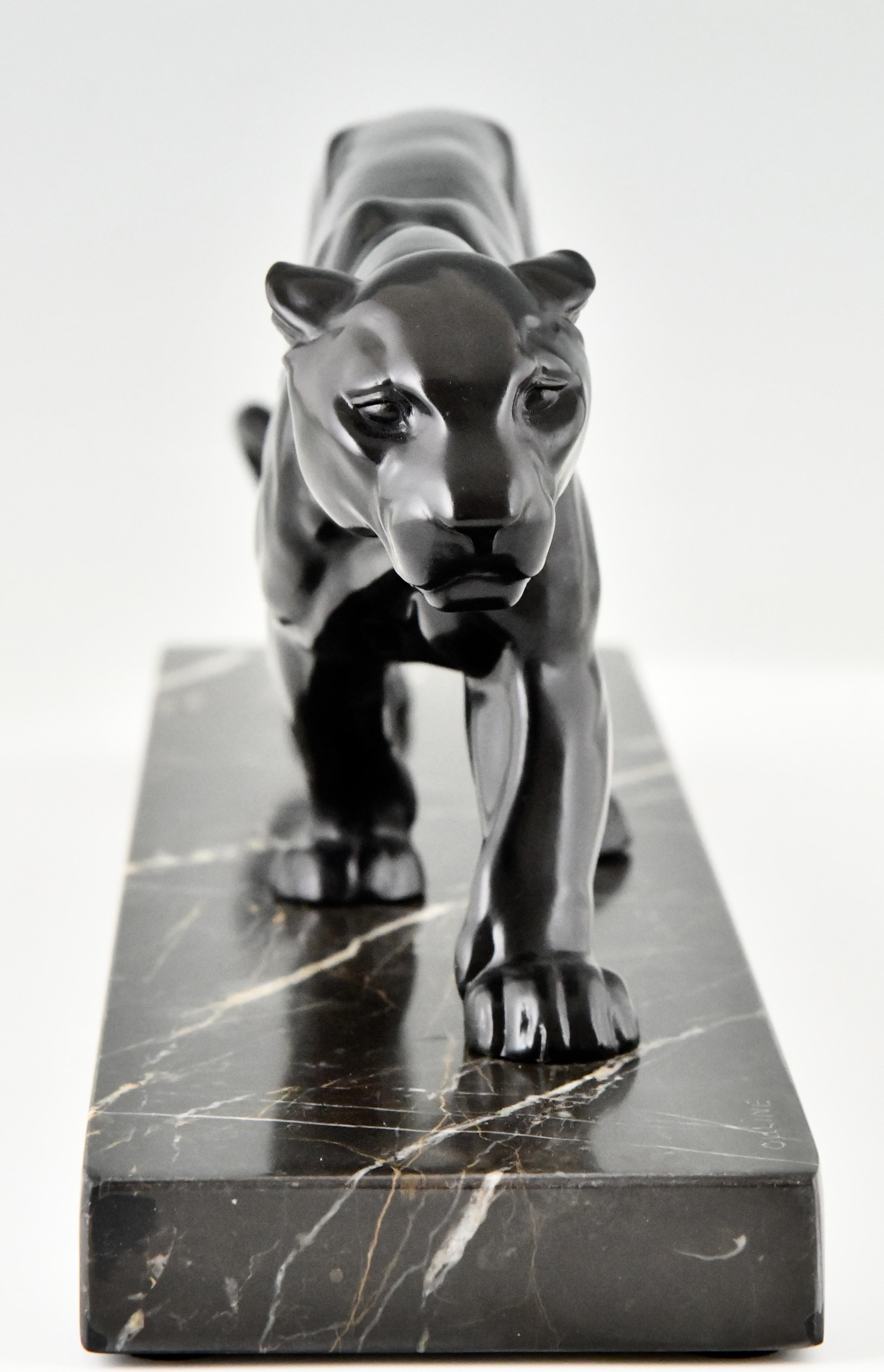 Metal Art Deco panther sculpture by Alexandre Ouline