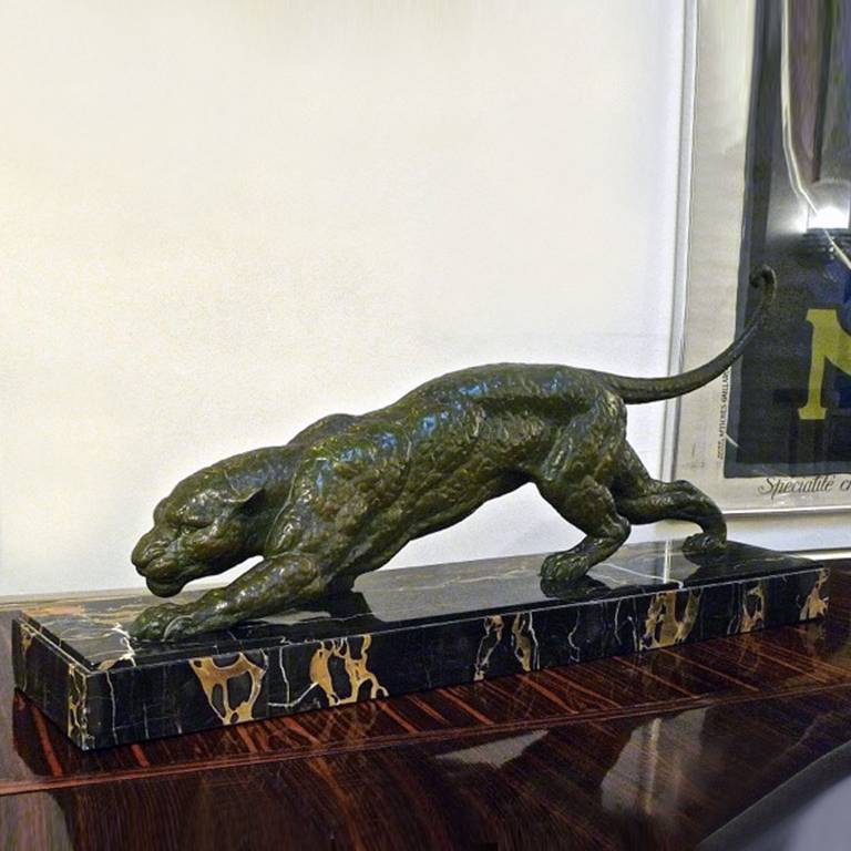 An original Art Deco spelter figure of a stalking panther, wonderful patina, on a Portoro marble base.
Signed 'D.H. Chiparus'. Very good condition, minor chips to the marble base.
Dimensions: 75 x 20 x 35 cm.

 