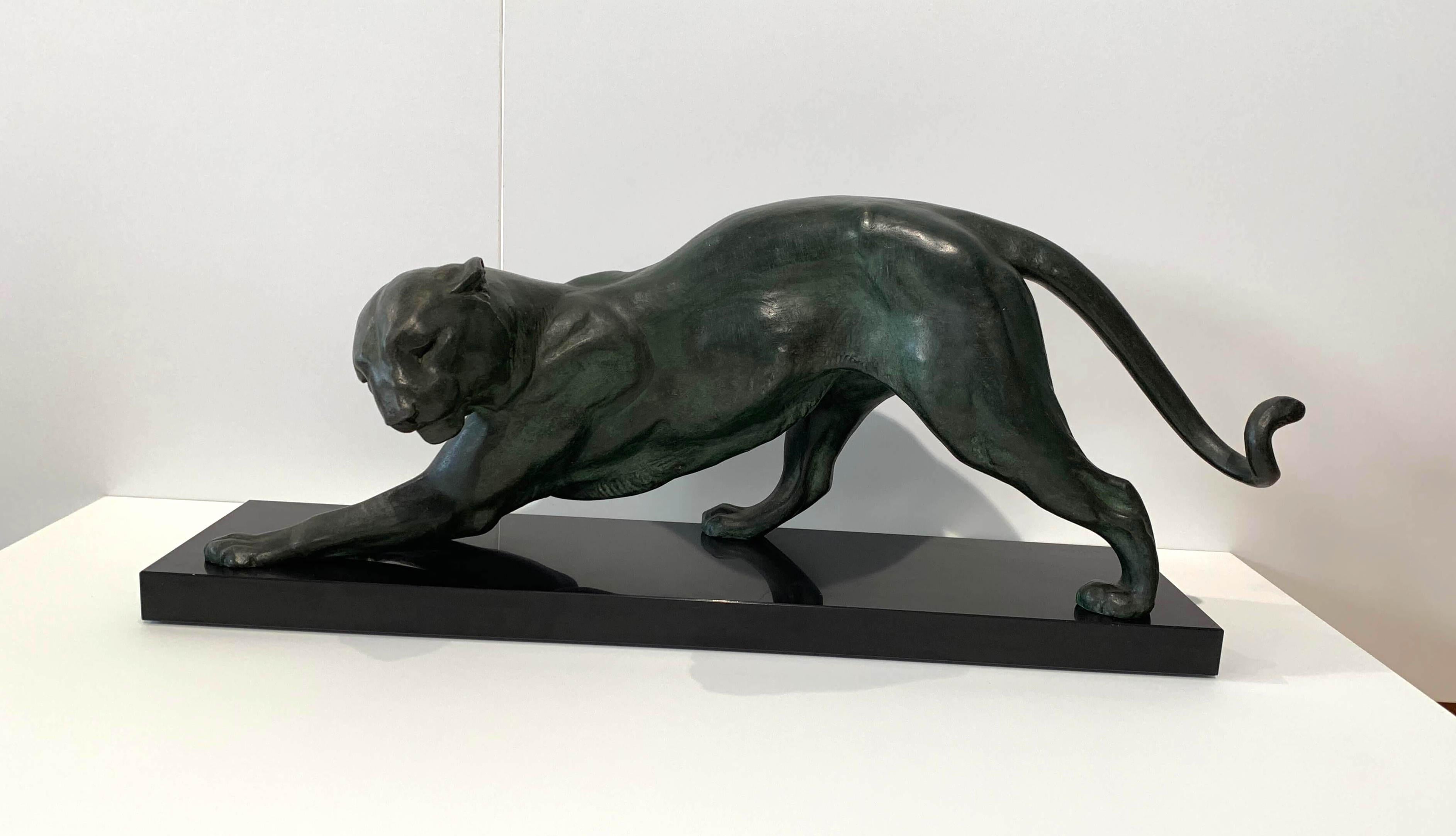 Large, very elegant original Art Deco Panther sculpture from France around 1925.
Signed: Plagnet, French artist active between 1920-1930
The animal is made of white bronze / cast zinc („fonte d‘art“) with a beautiful greenish patina.
It stands on